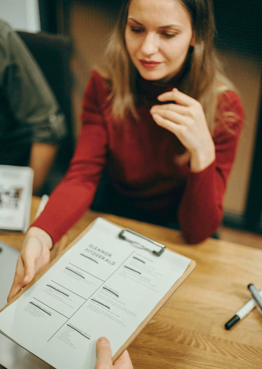 eager woman filling out job application