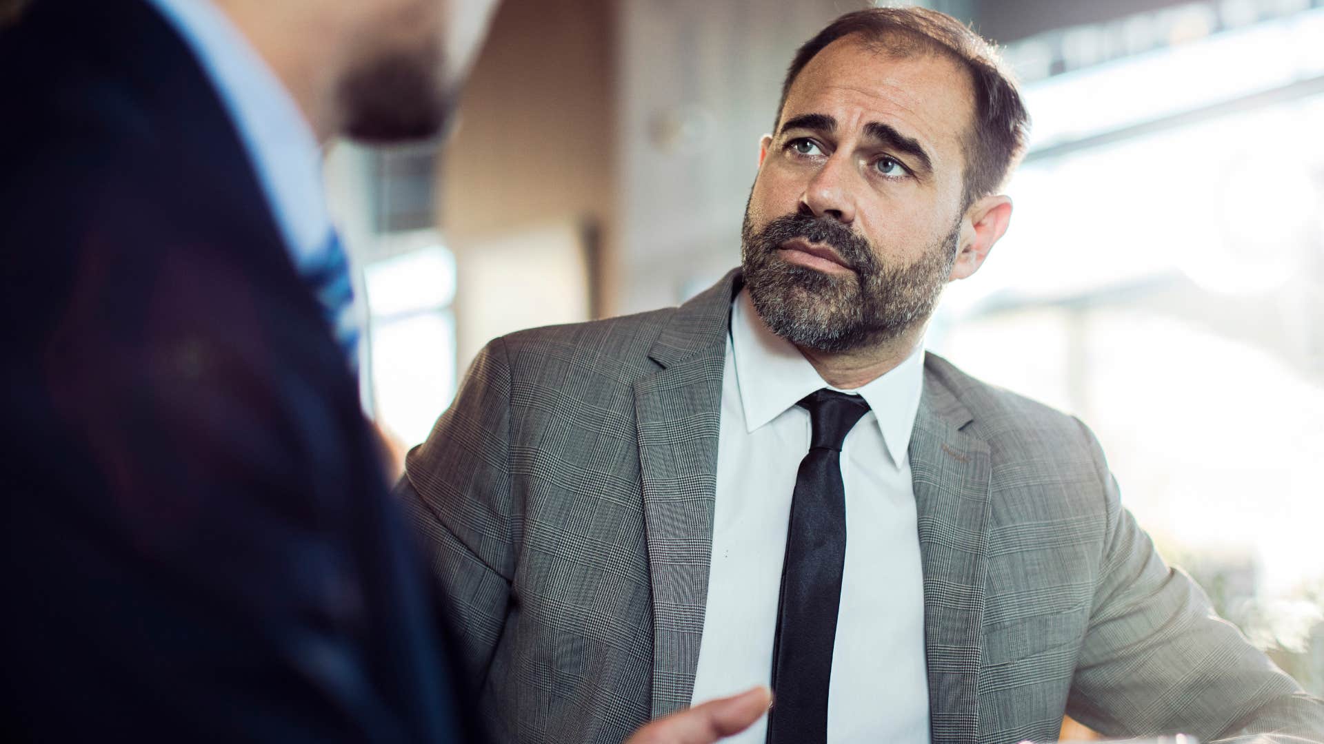 man saying you're so confident in your incorrectness to work colleague