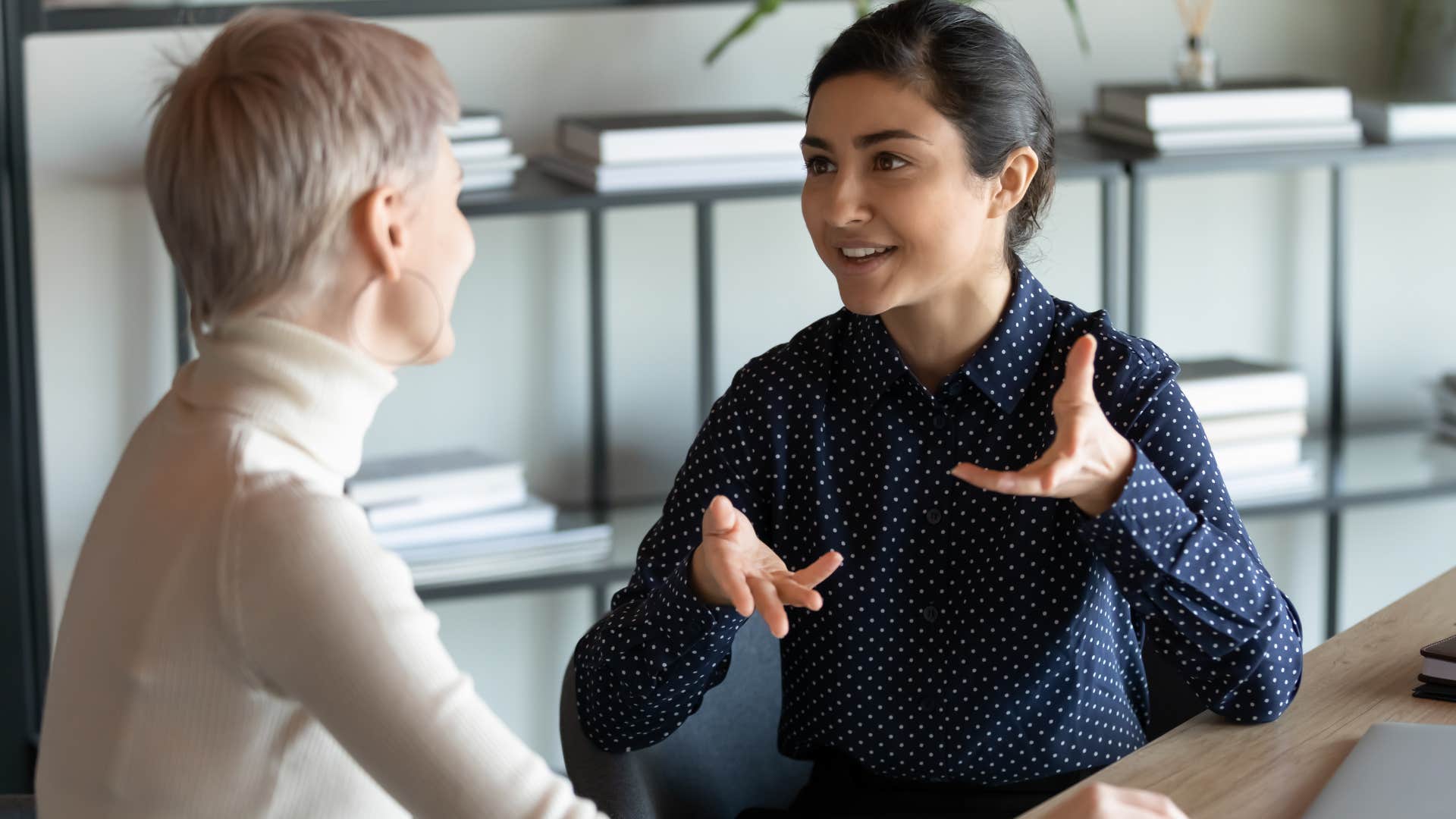 woman saying I hear you to a co-worker