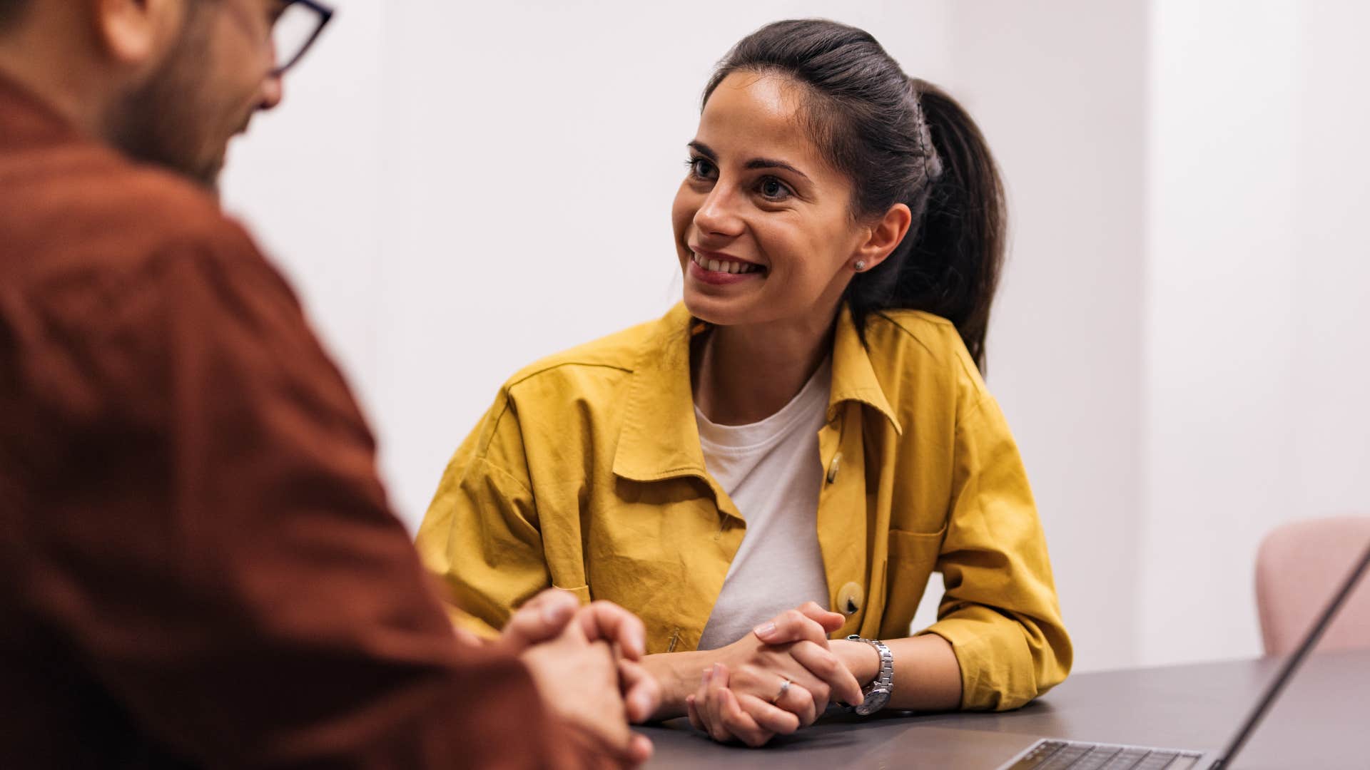 woman smiling and saying I trust you at work to colleague