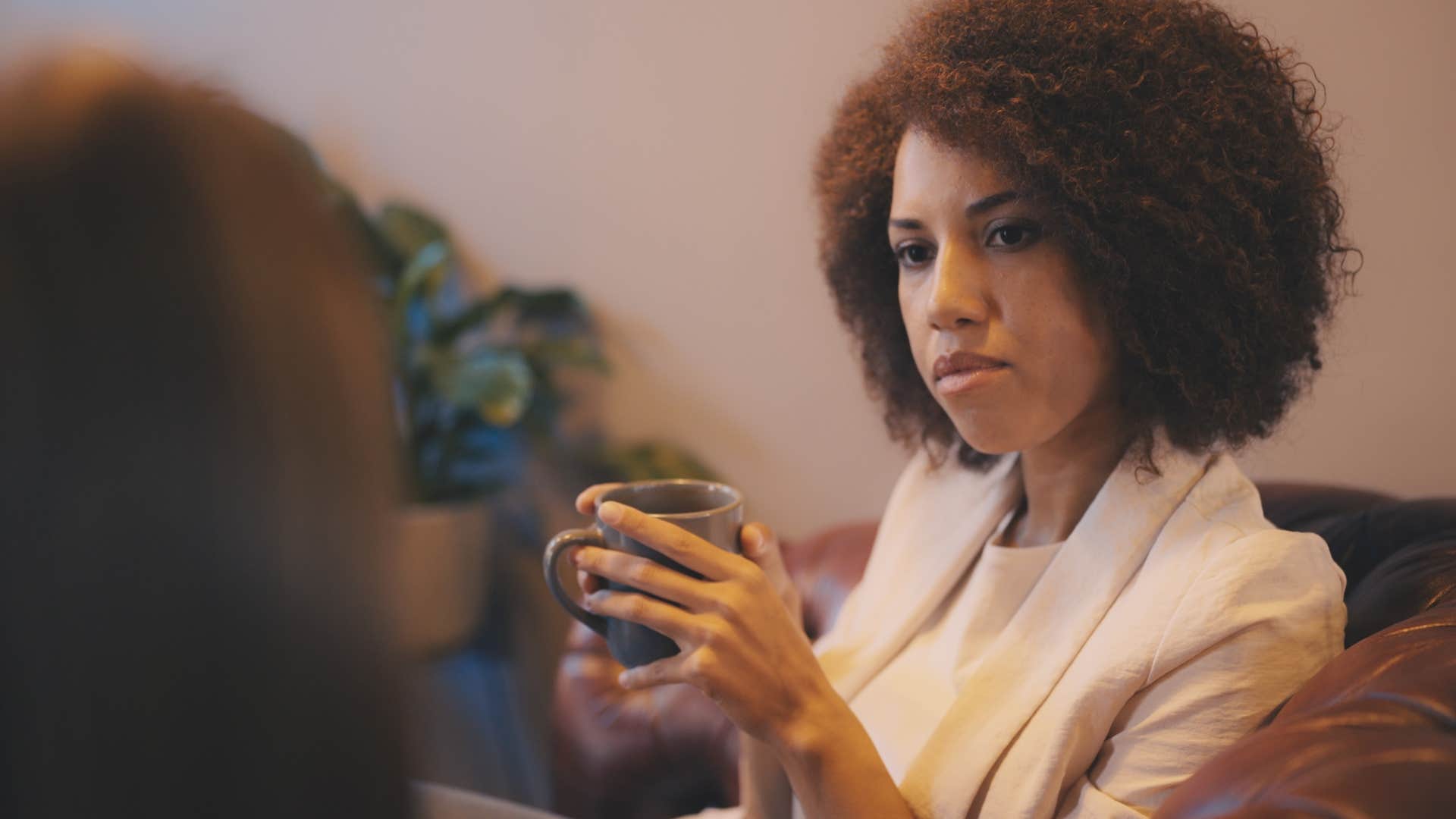 serious woman saying that's a fair concern to friend