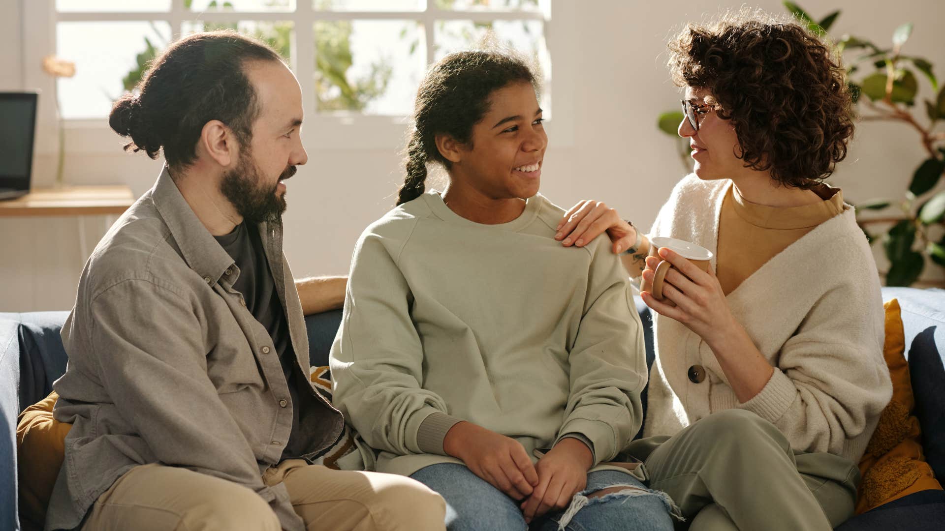 teenage girl having adult talks with parents
