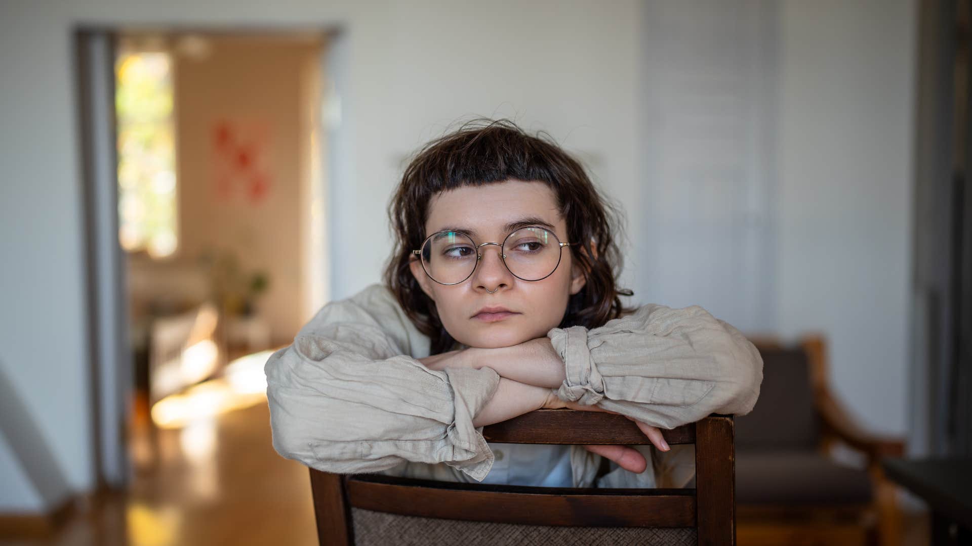 upset teen girl self-soothing at home