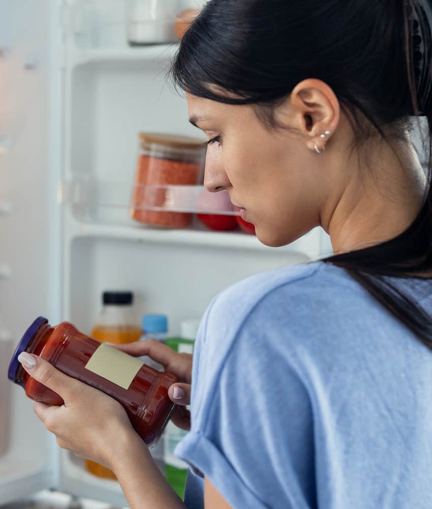 woman raised single mom checking expiration date