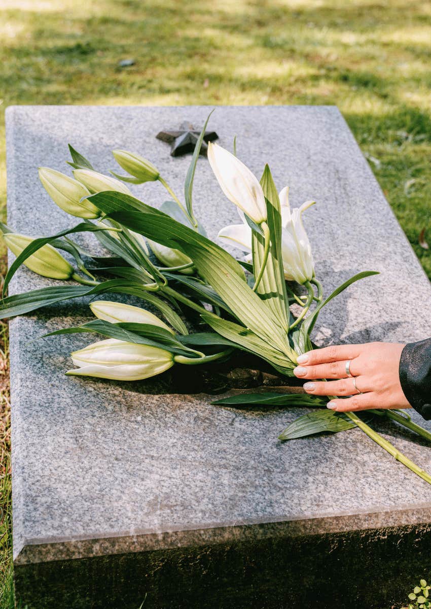 flowers being left at grave