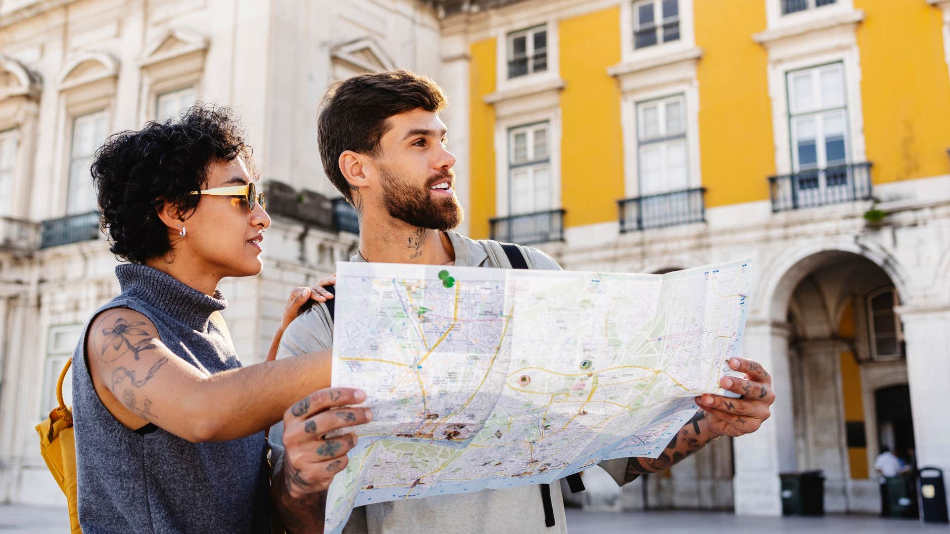 High achieving couple share control of map on vacation