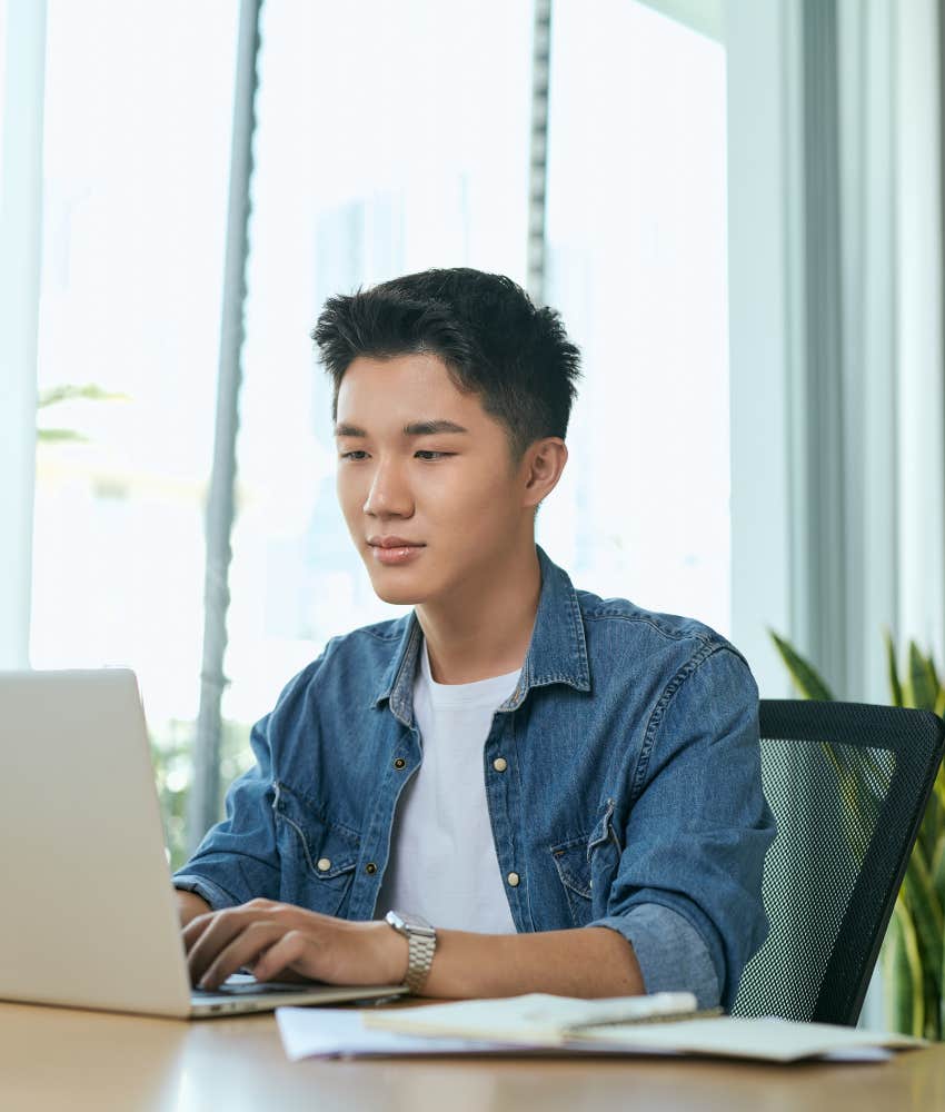 young man working towards goals at job