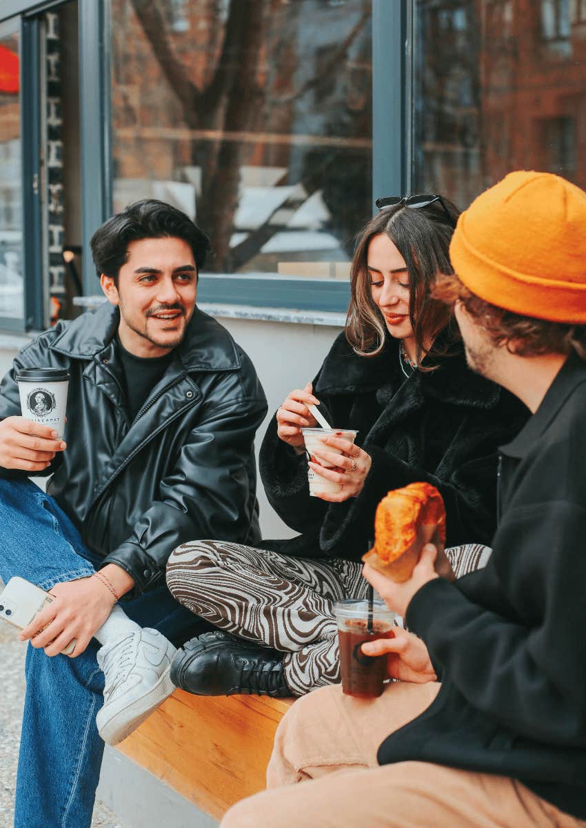 group of agreeable friends talking outdoors