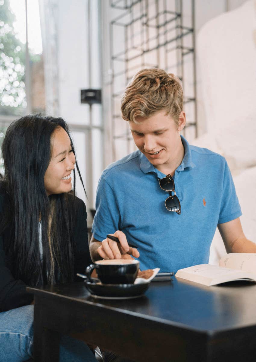 happy couple sitting together at a cafe