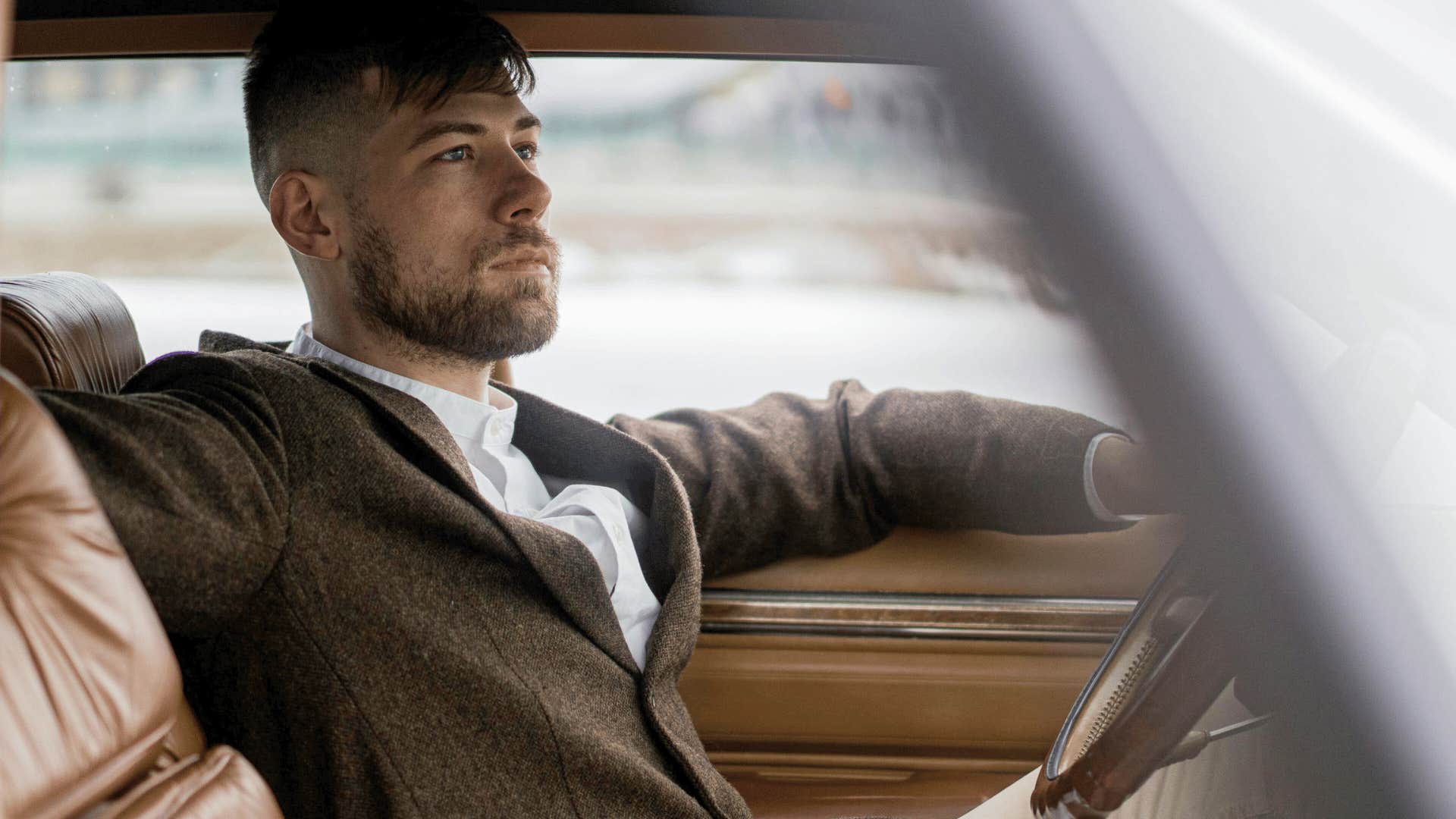 happy parent sitting alone in car