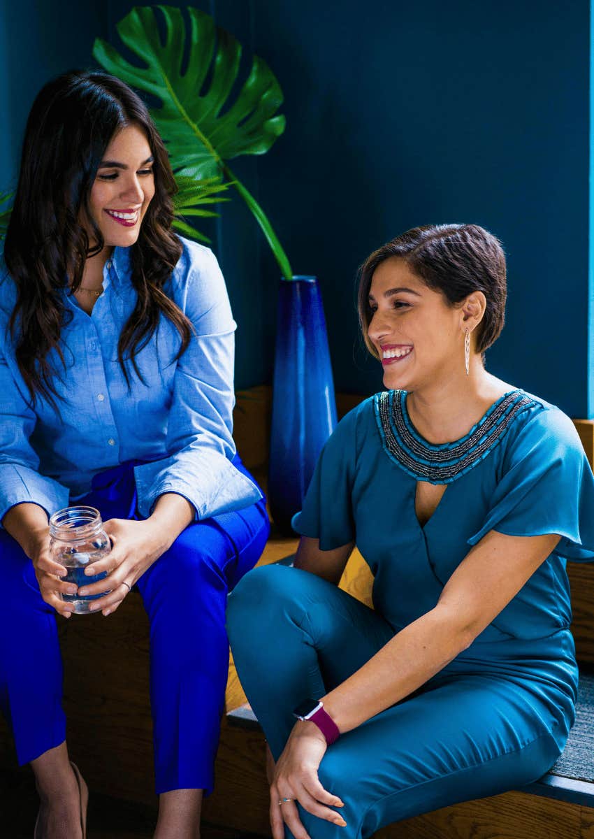 happy women smiling next to each other