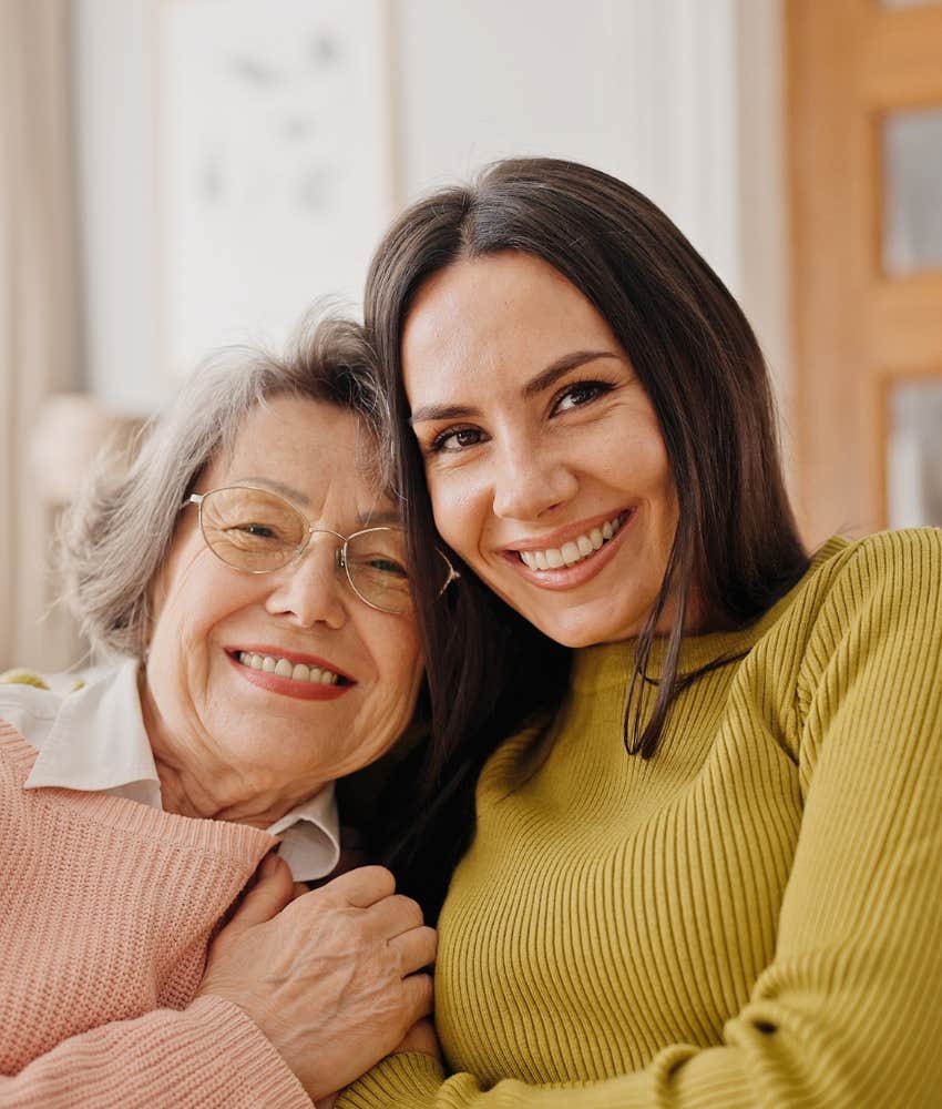 Happy person hugs elder showing how understanding brings family back together