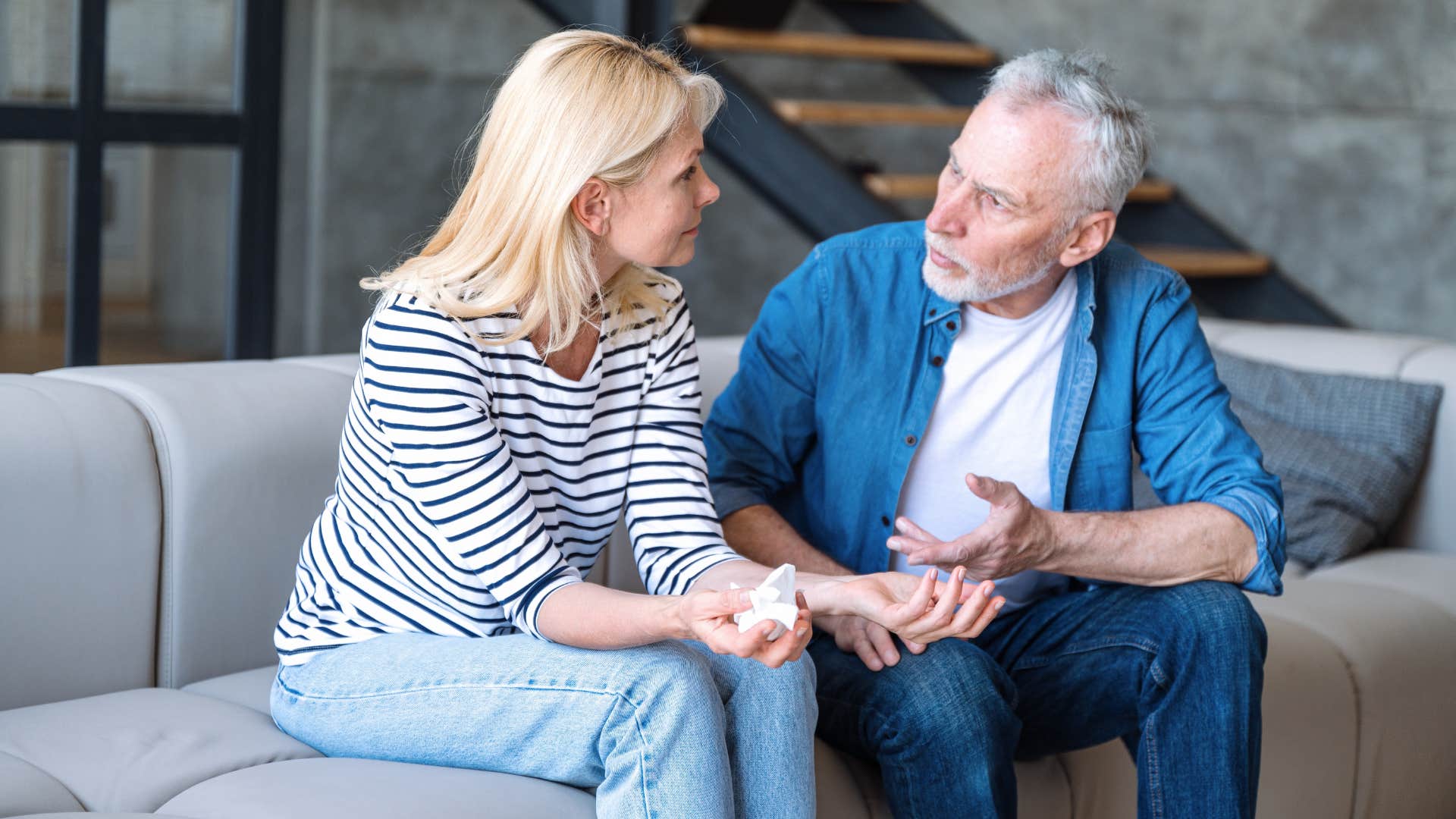 man joking about divorcing or leaving the marriage as woman looks upset