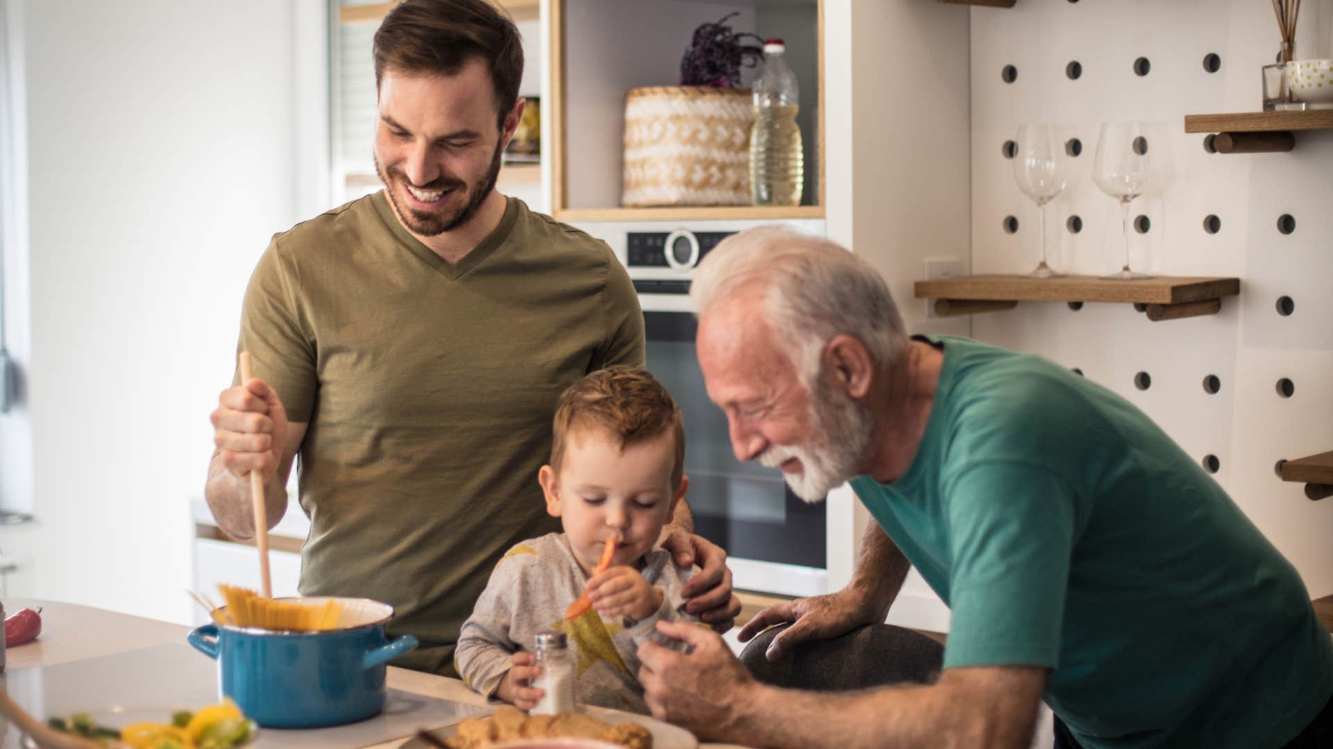 grandpa making food from scratch with his son and grandson