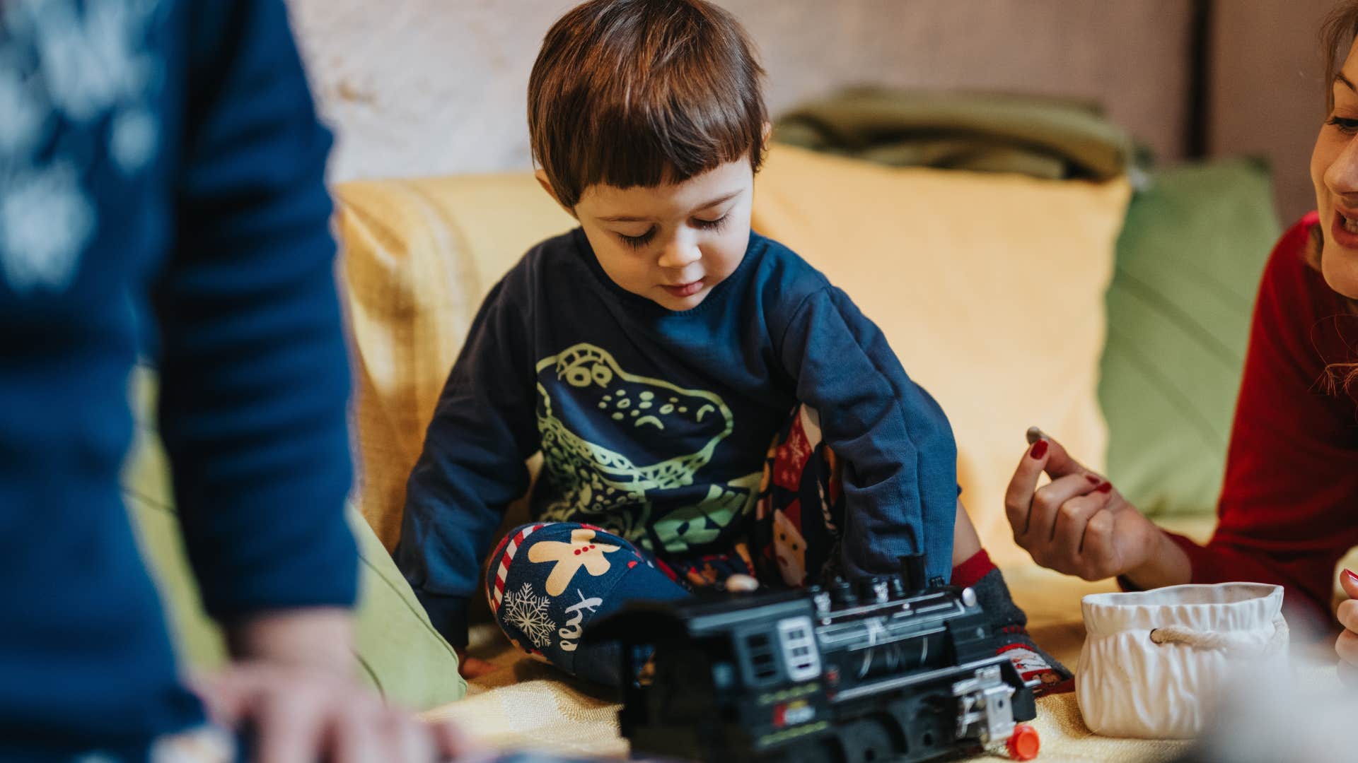 little kids making model planes and trains with grandparents