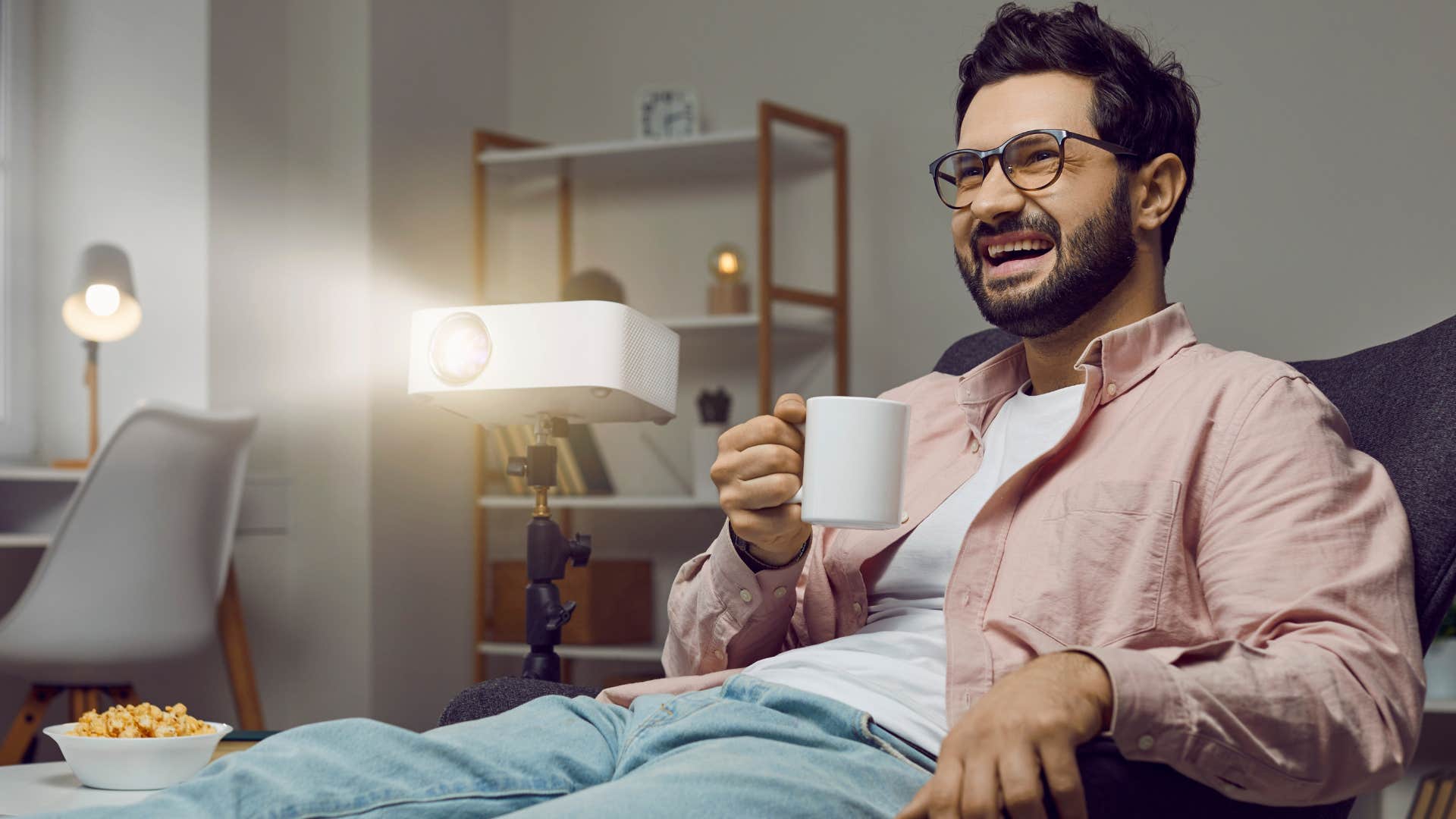 man watching his comfort movies and TV at home