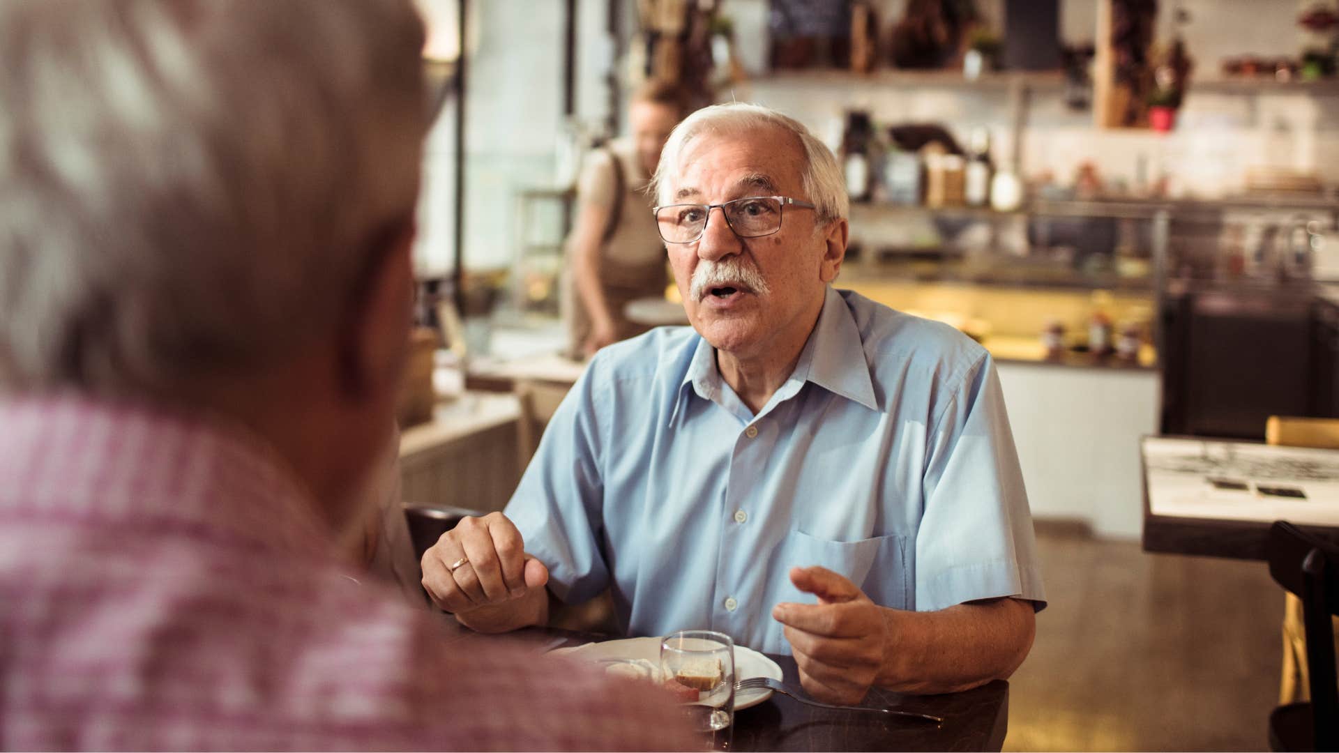 man being defensive telling friend I didn't do anything wrong