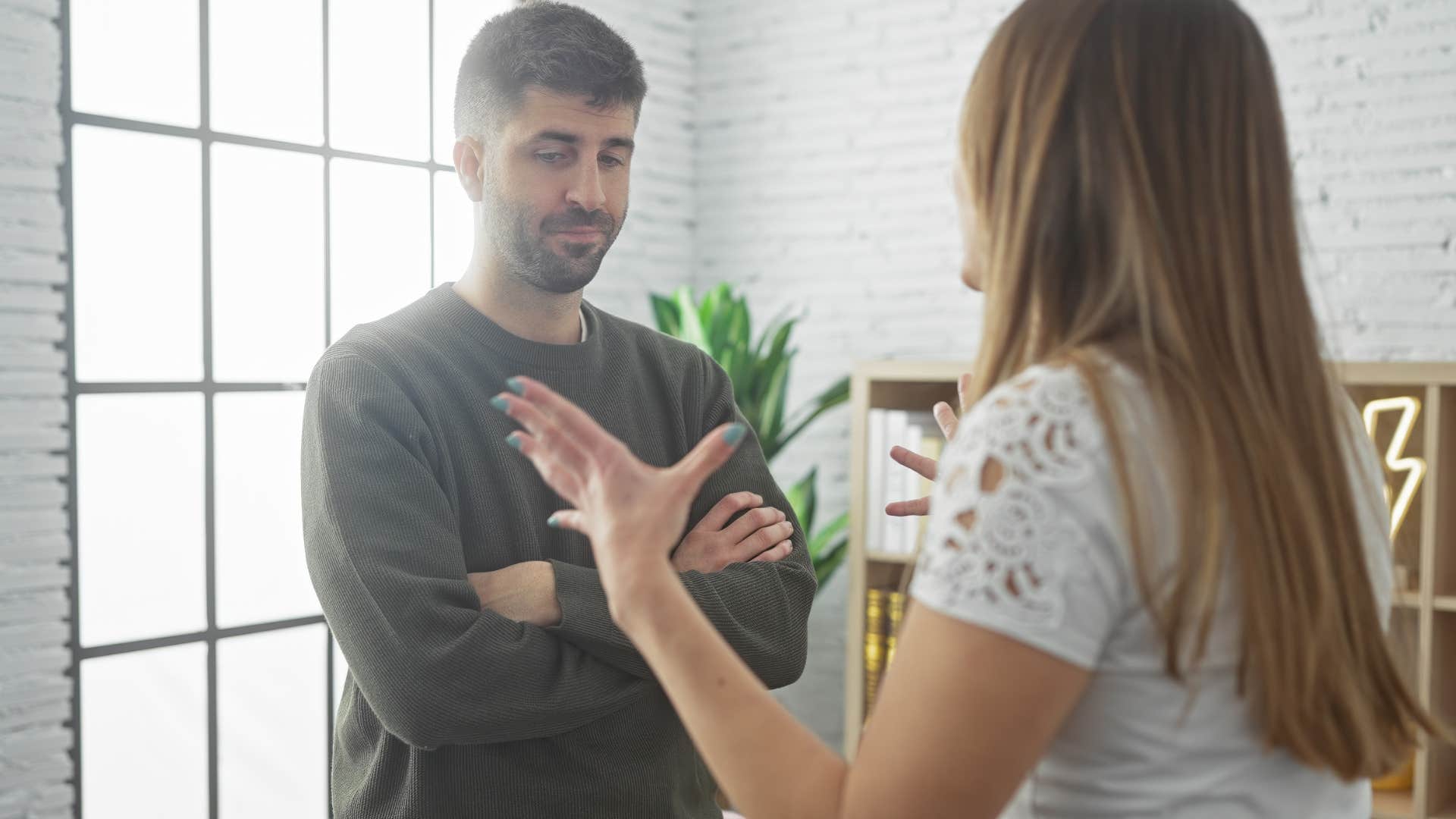 defensive man saying that's not what I meant to his upset partner