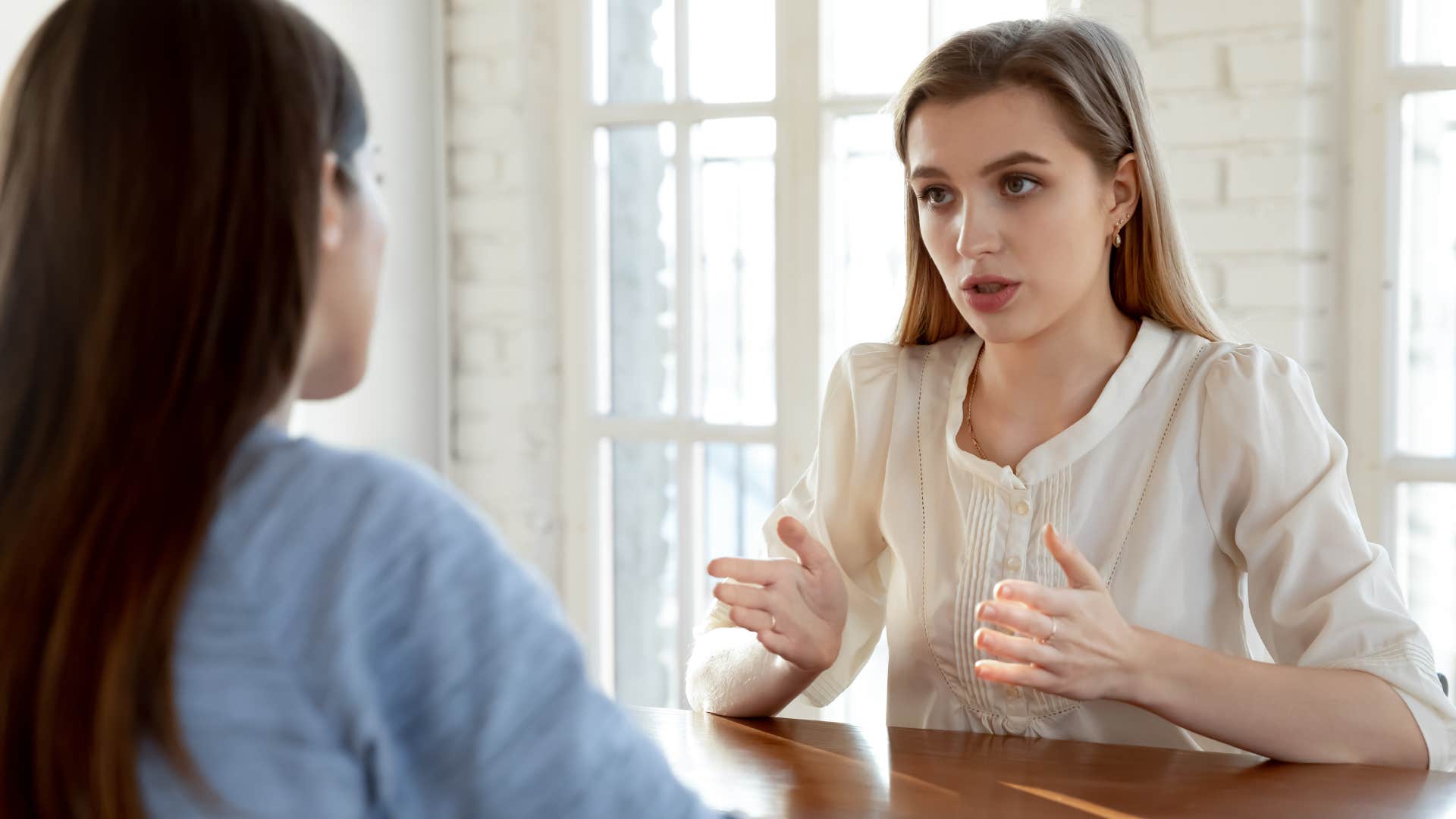 selfish woman telling colleague this isn't about you