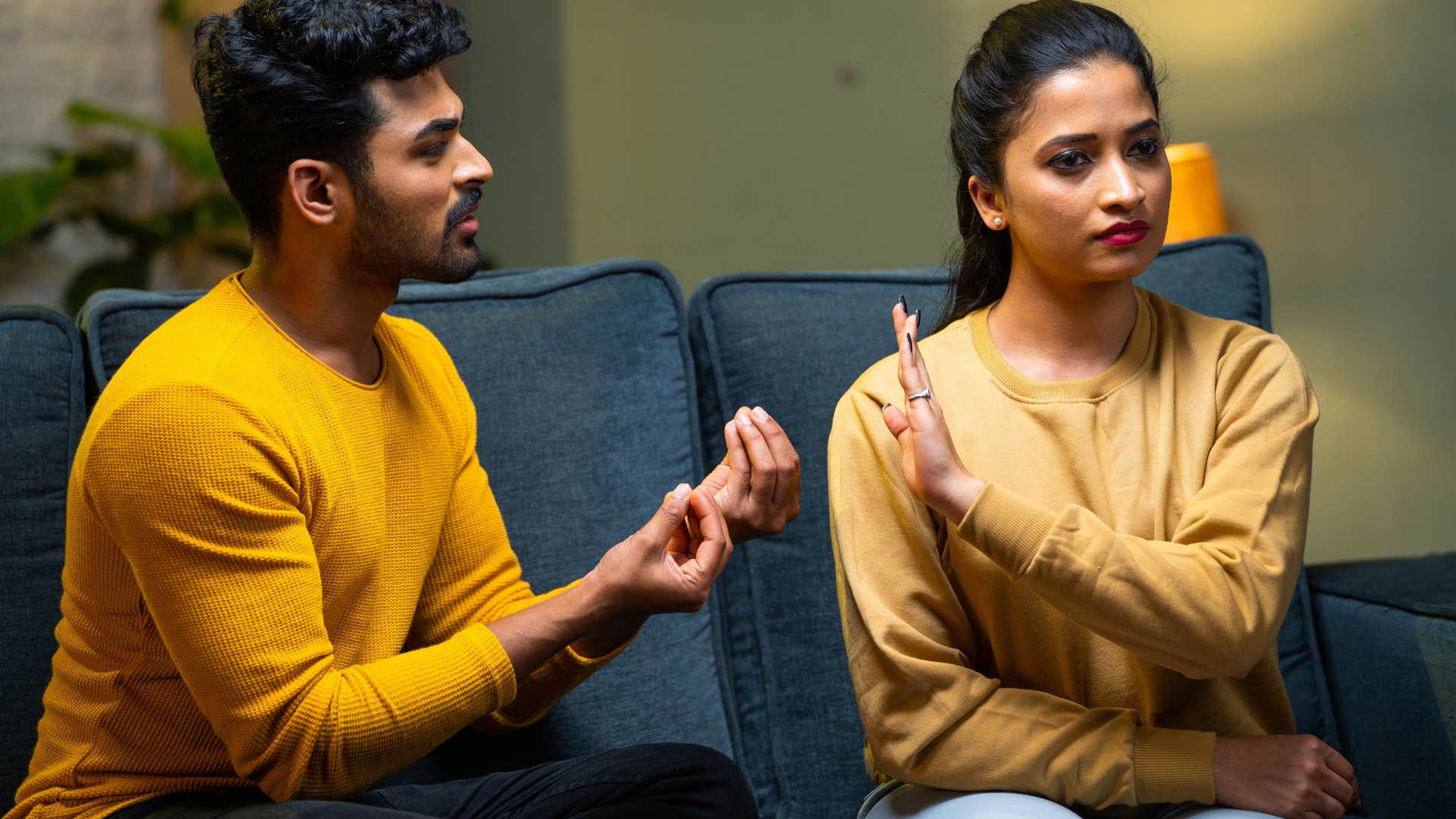 man telling his upset wife you're overreacting
