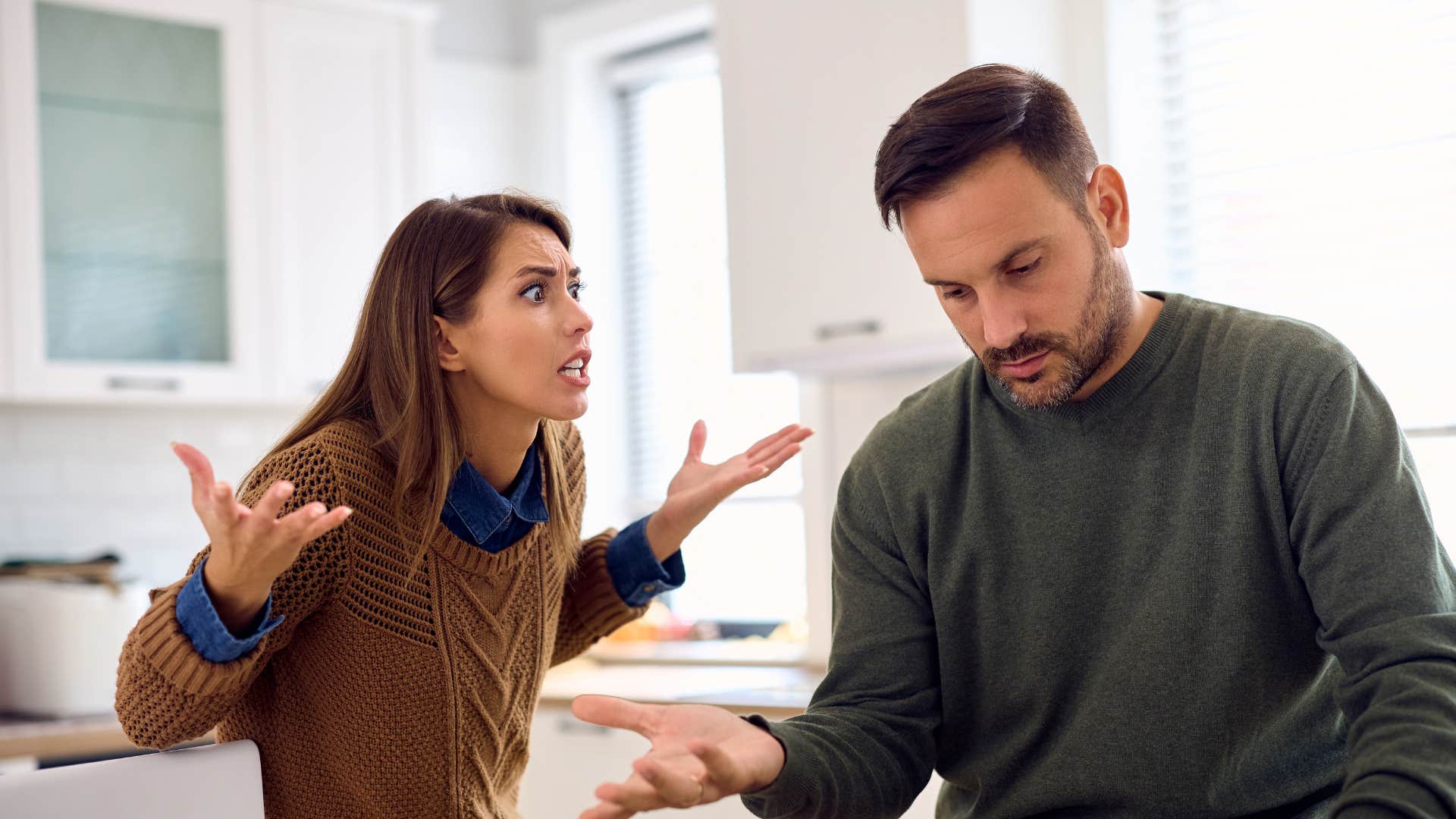 Upset couple argue showing relationship hangin by a thread