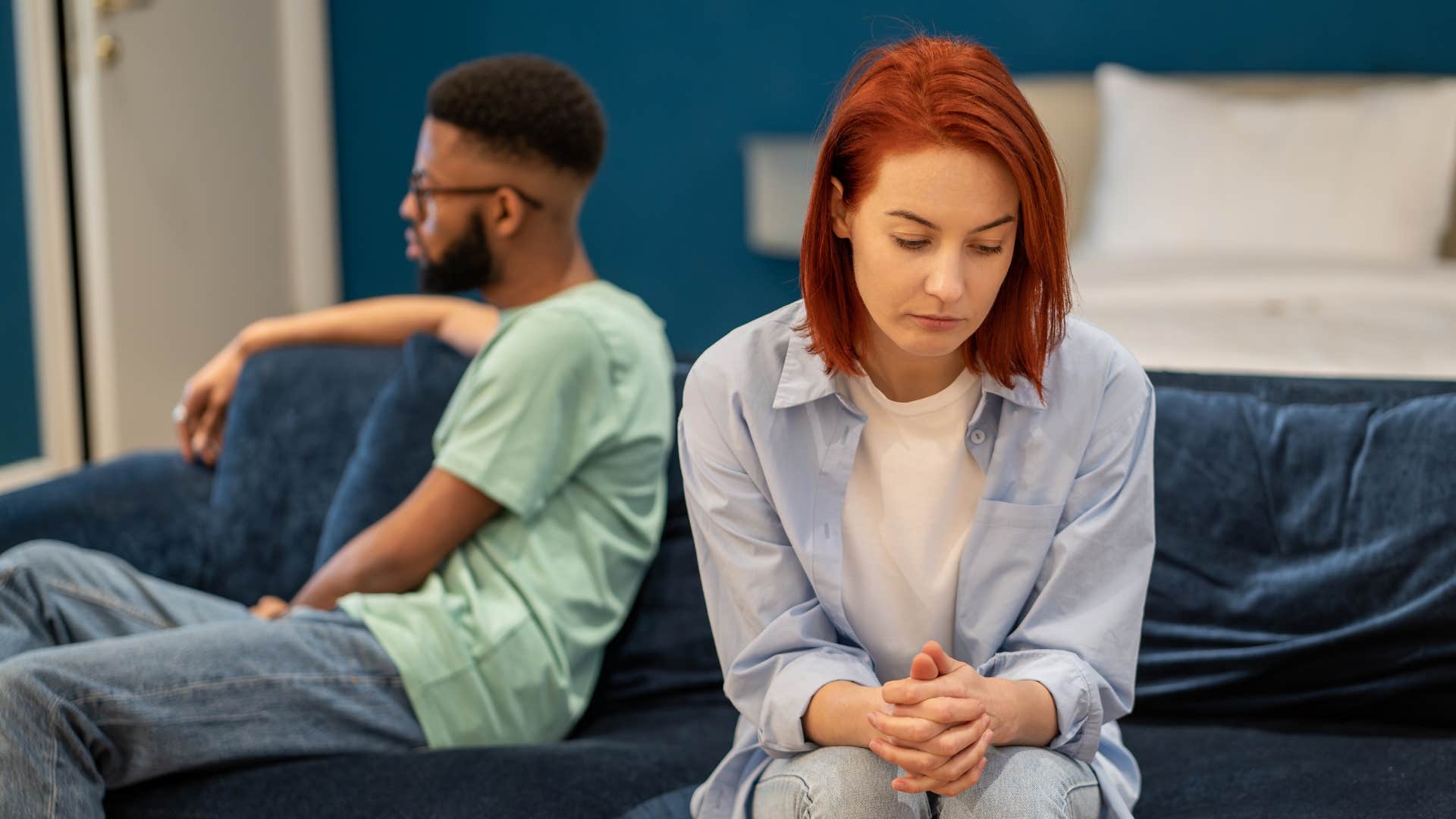 Upset couple turn away from difficulty showing relationship hanging by a thread