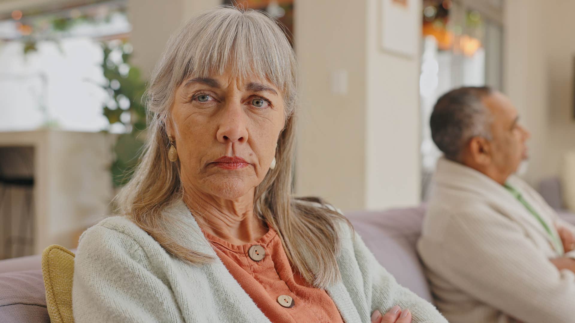 unhappy woman avoiding hard conversations with her husband