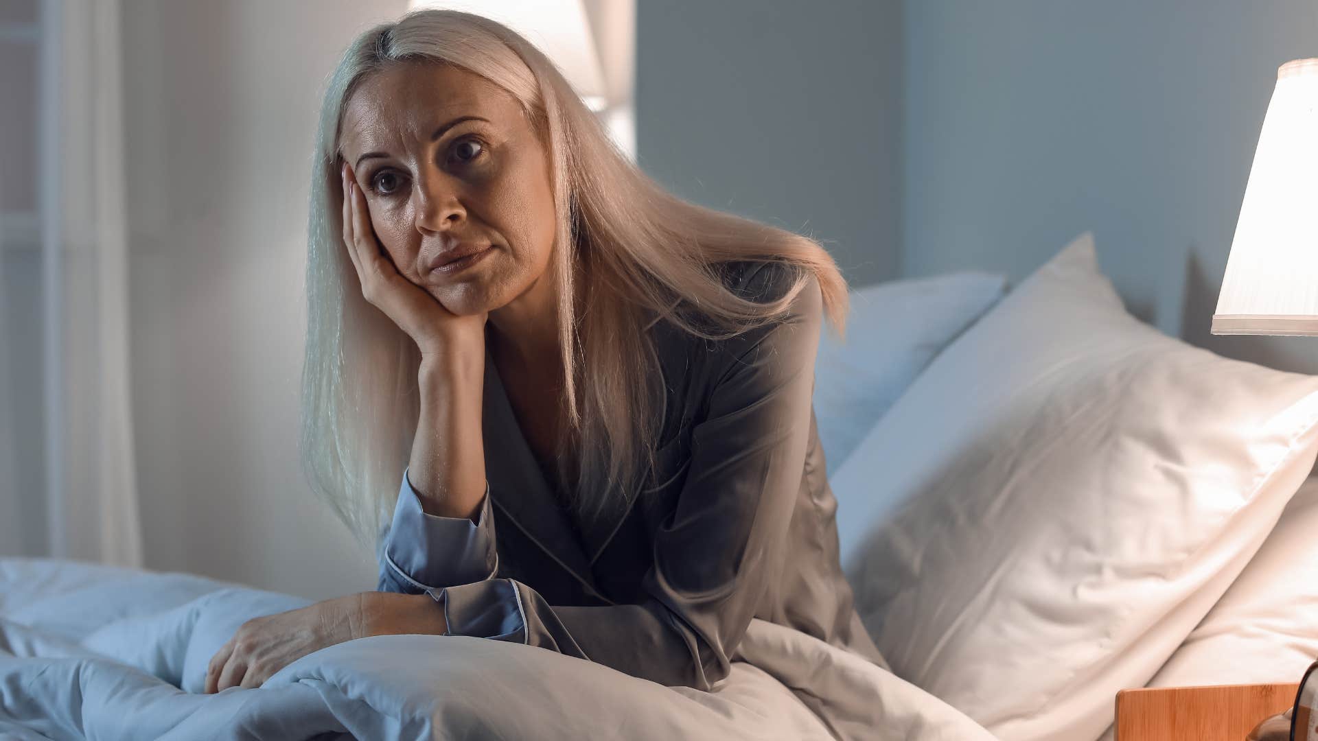 unhappy woman without shared routines waking up alone in bed