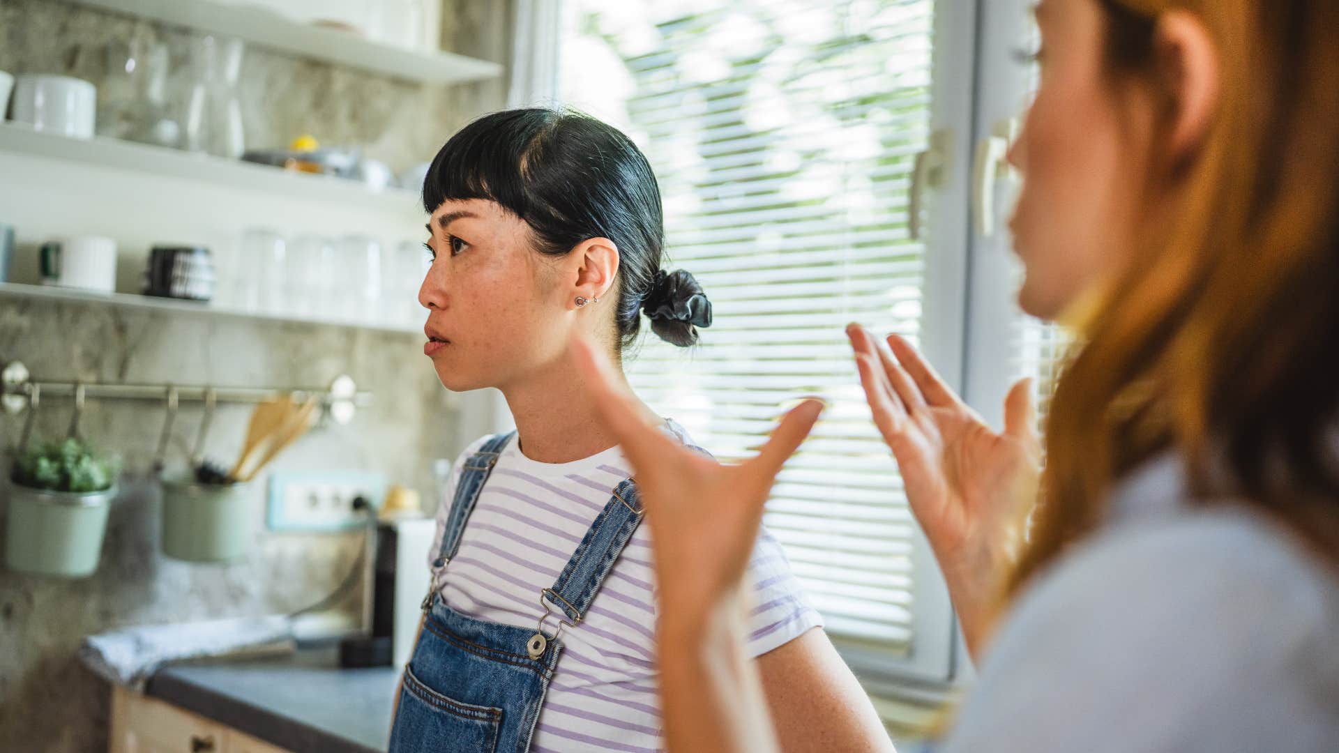 friend talking to lazy woman refusing to apologize for her actions