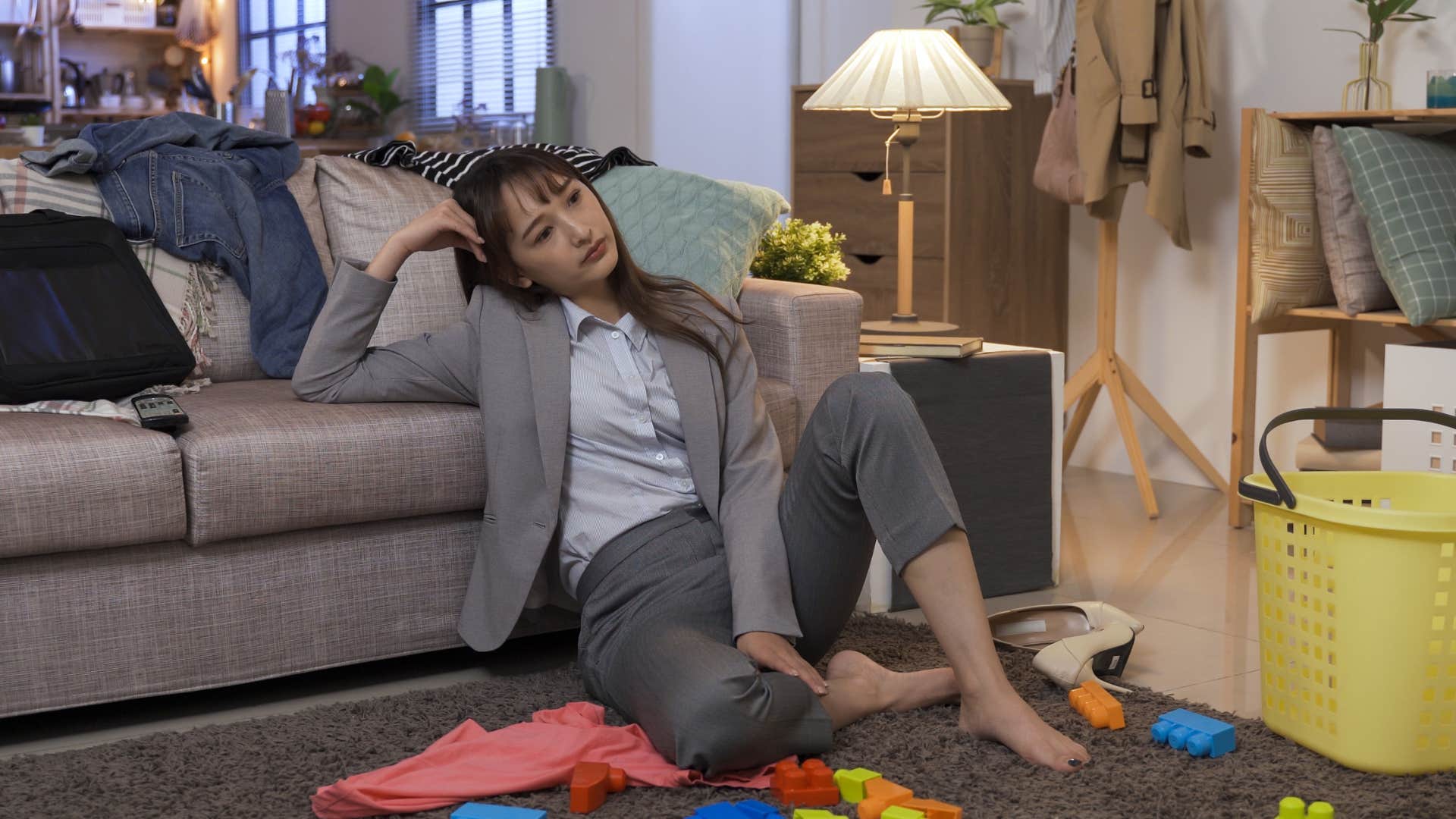 lazy woman refusing to do chores in untidy room