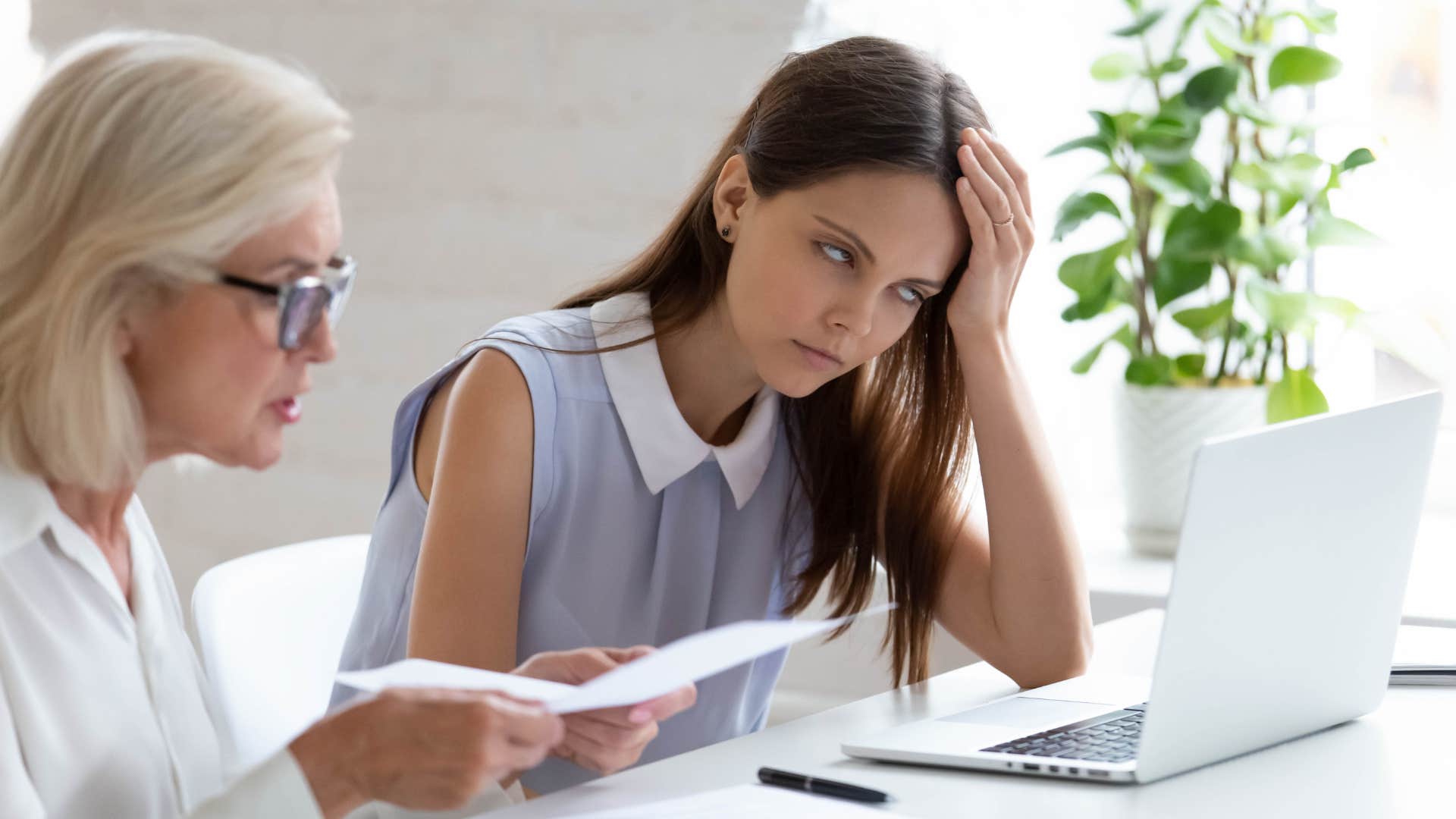 lazy woman being unhelpful to co-worker on purpose