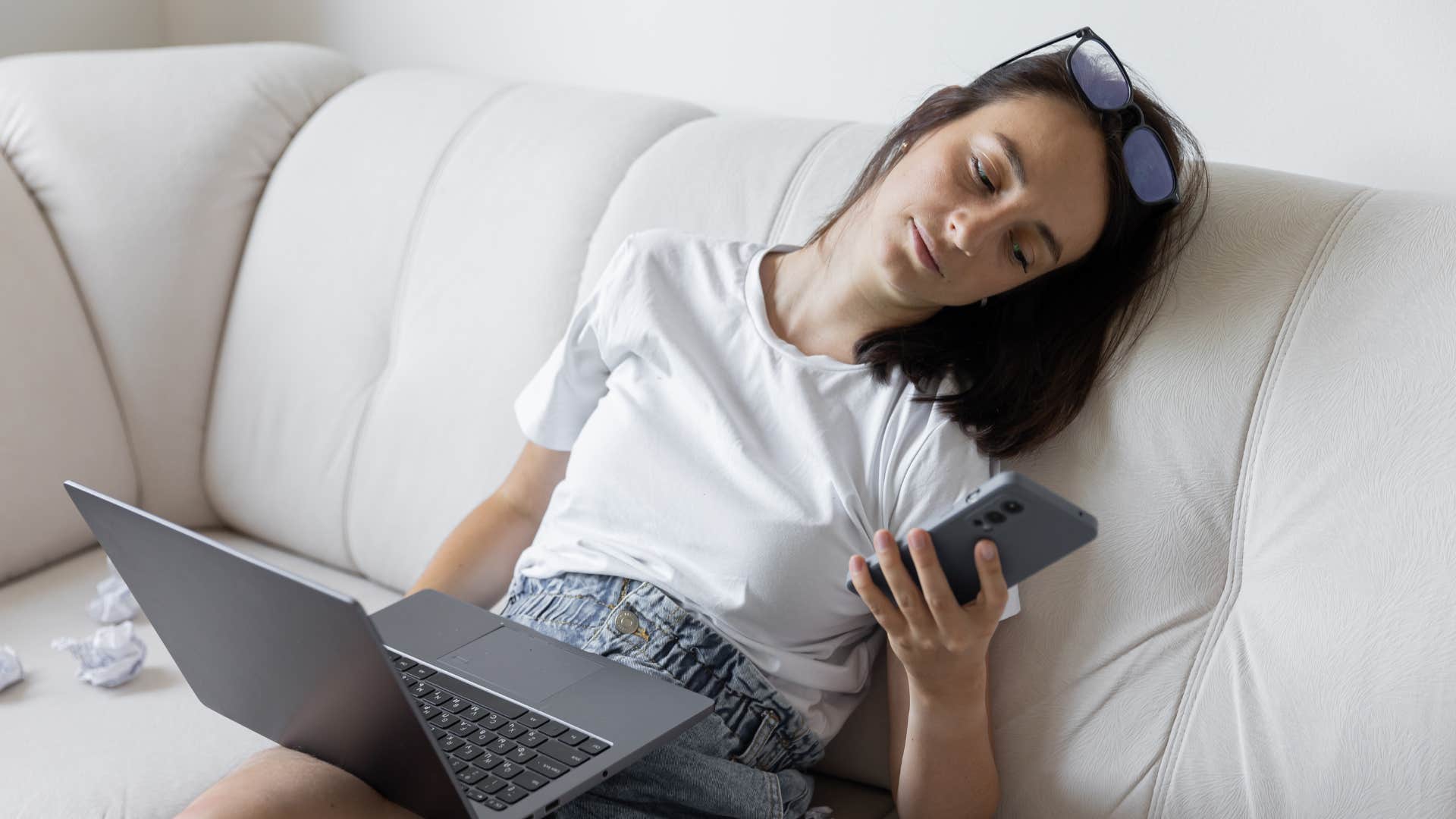 lazy woman not wanting to plan ahead looking at her phone