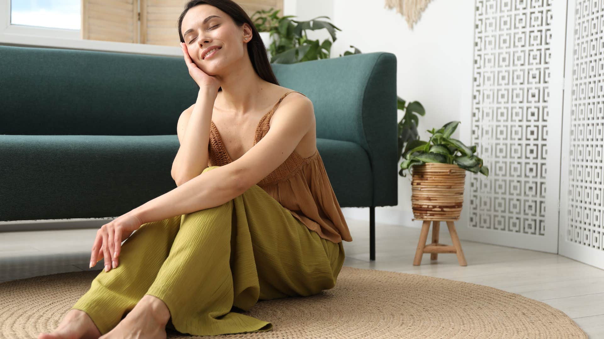 emotionally regulated woman at peace sitting on floor