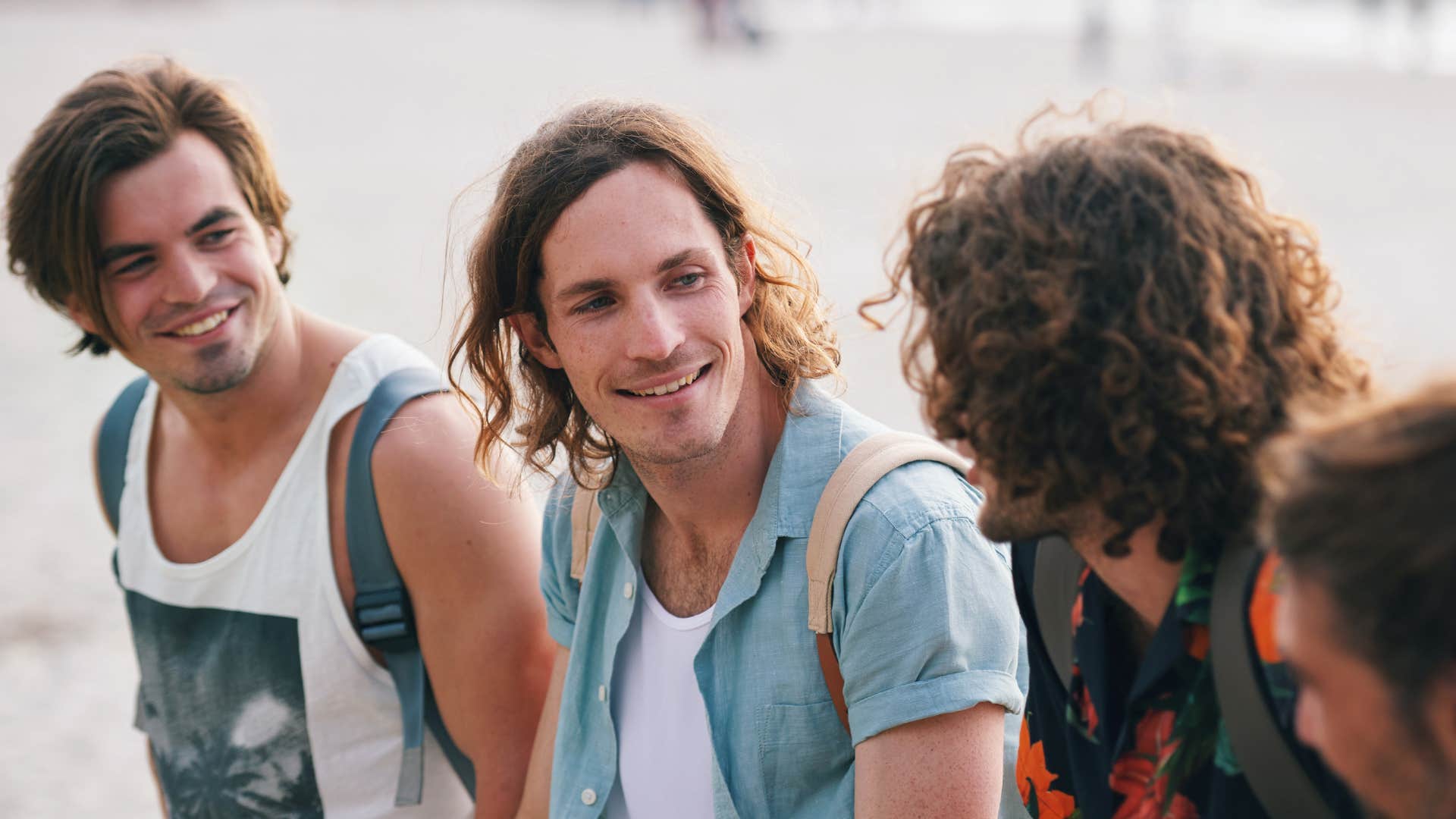 Young man trying to figure out if a friend is low quality sharing secrets