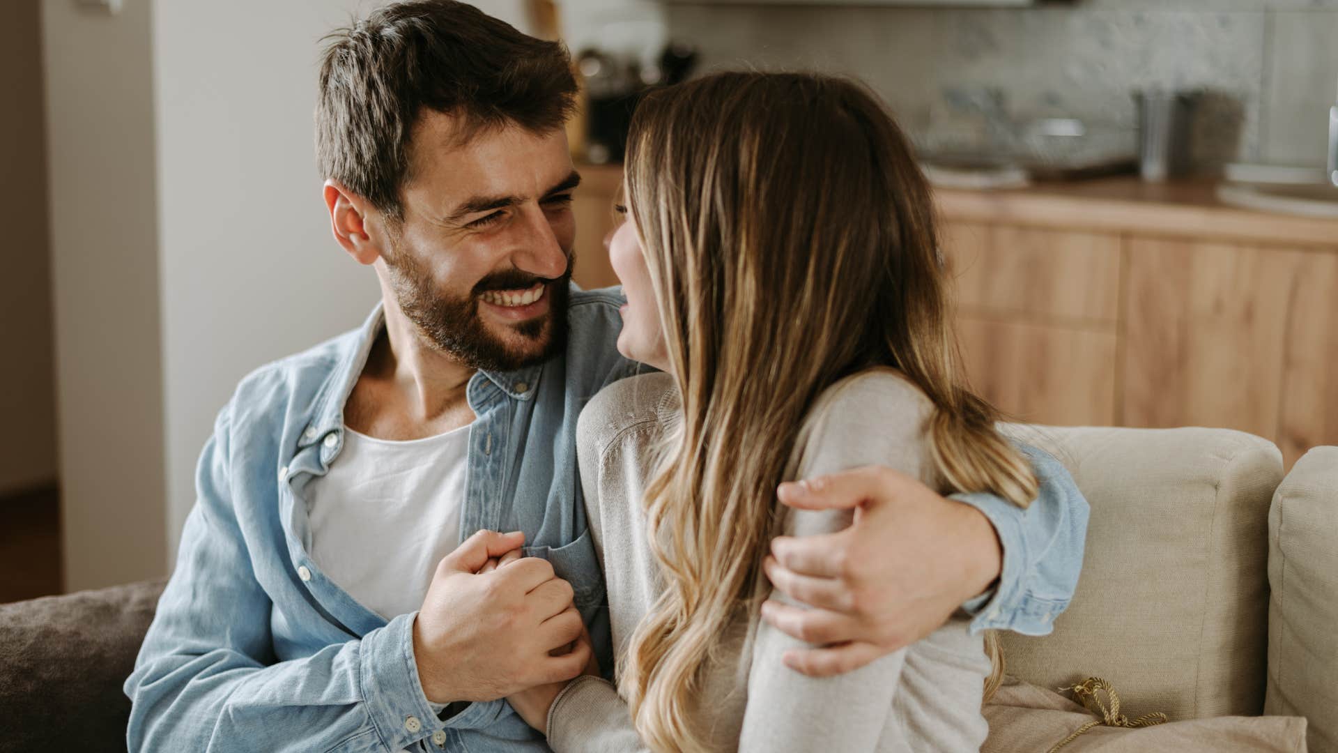 man expressing gratitude smiling at his wife