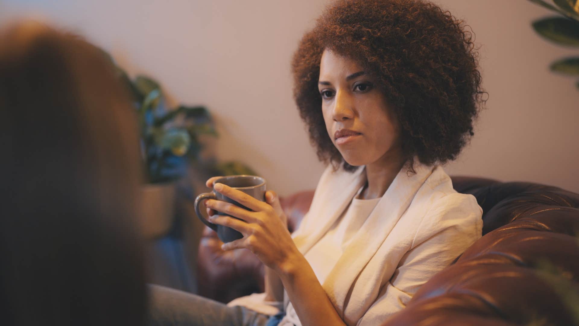 woman who's mindful of how her words and actions affect others listening to friend talk