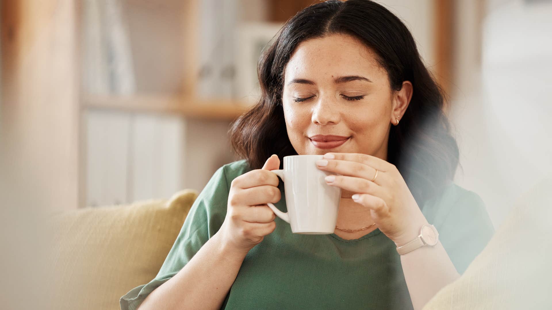 quiet woman with strong morals drinking coffee at home