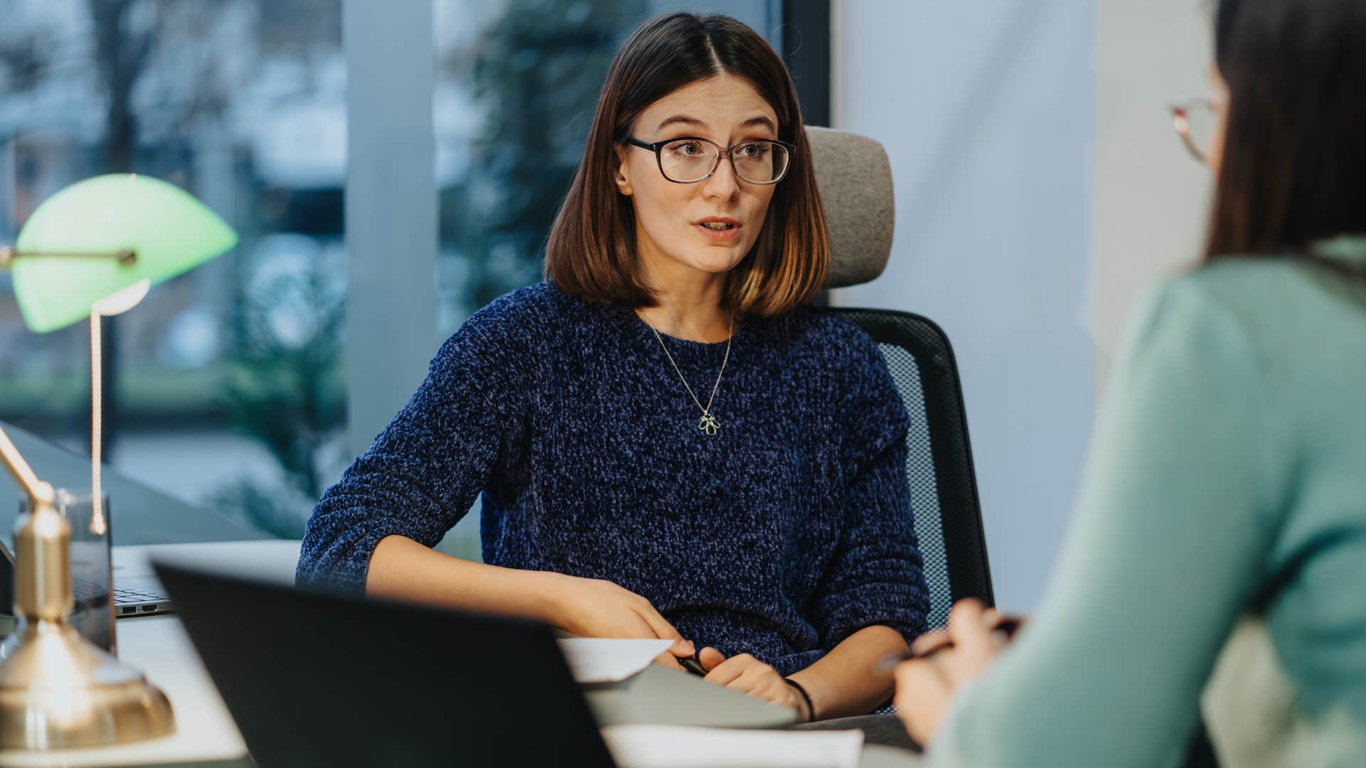stern woman taking responsibility for her actions at work