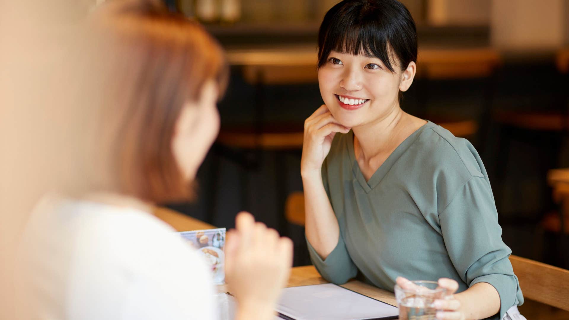 insecure woman smiling saying i already knew that
