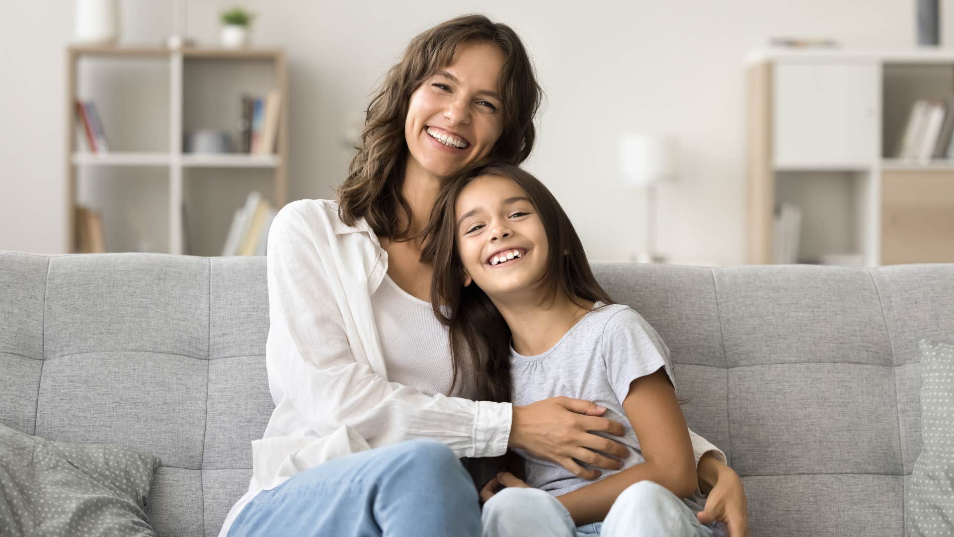 Happy mother embraces smiling daughter showing change forever