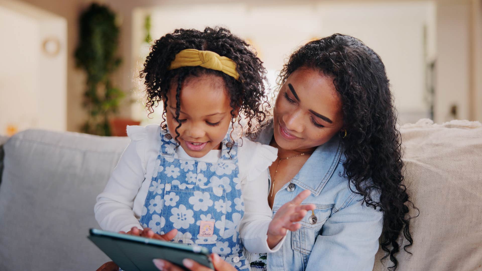 Proud mother listens to daughter read showing change forever