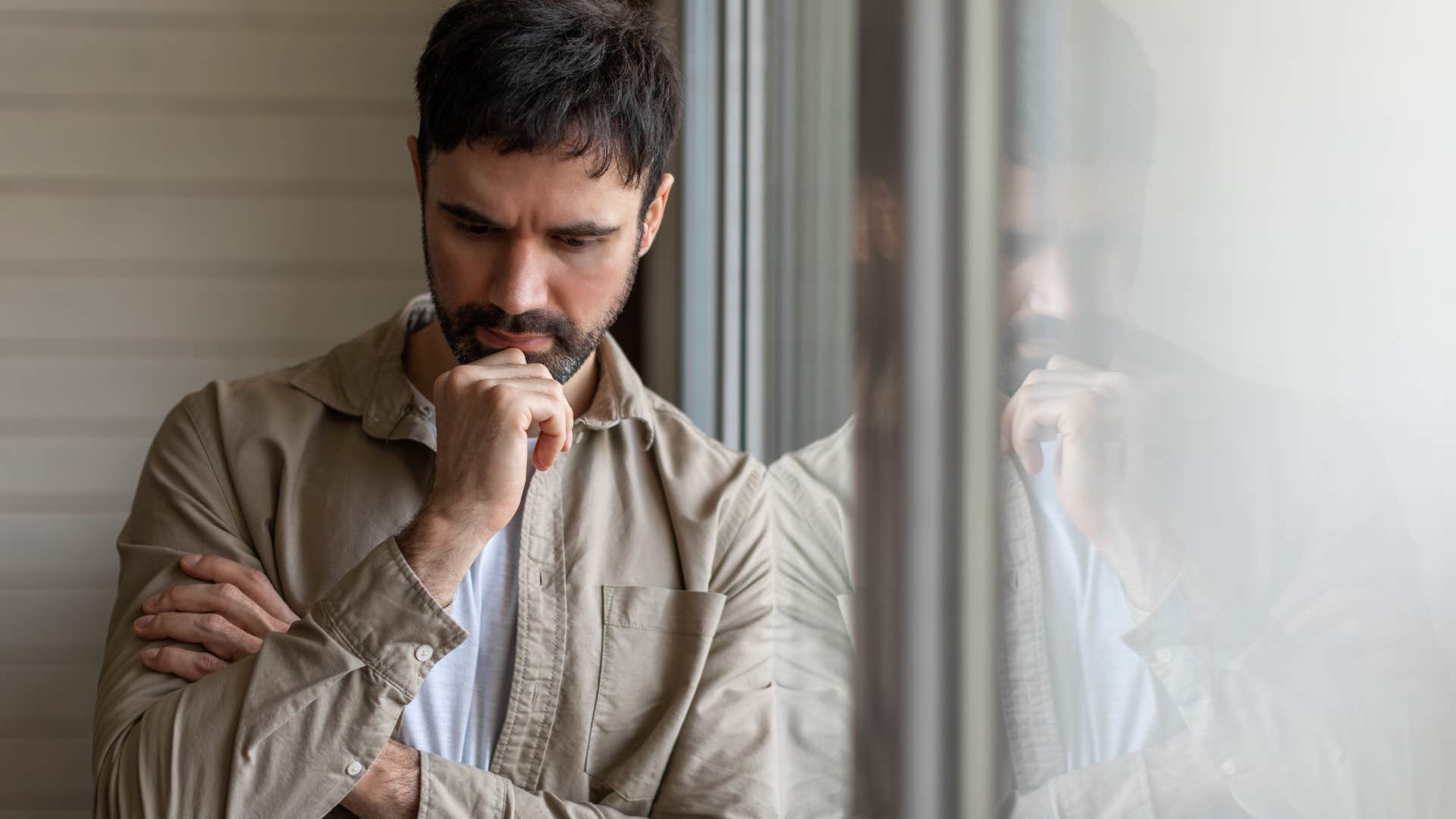 man handling criticism gracefully thinking intensely