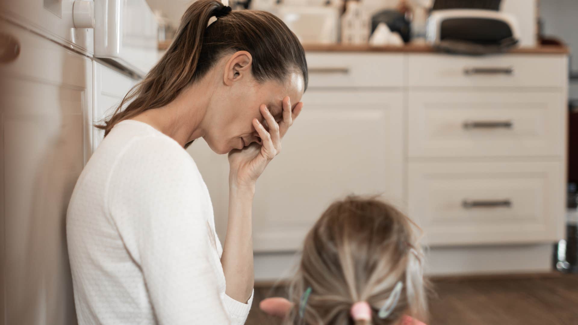 Woman worrying about existentialism at home.