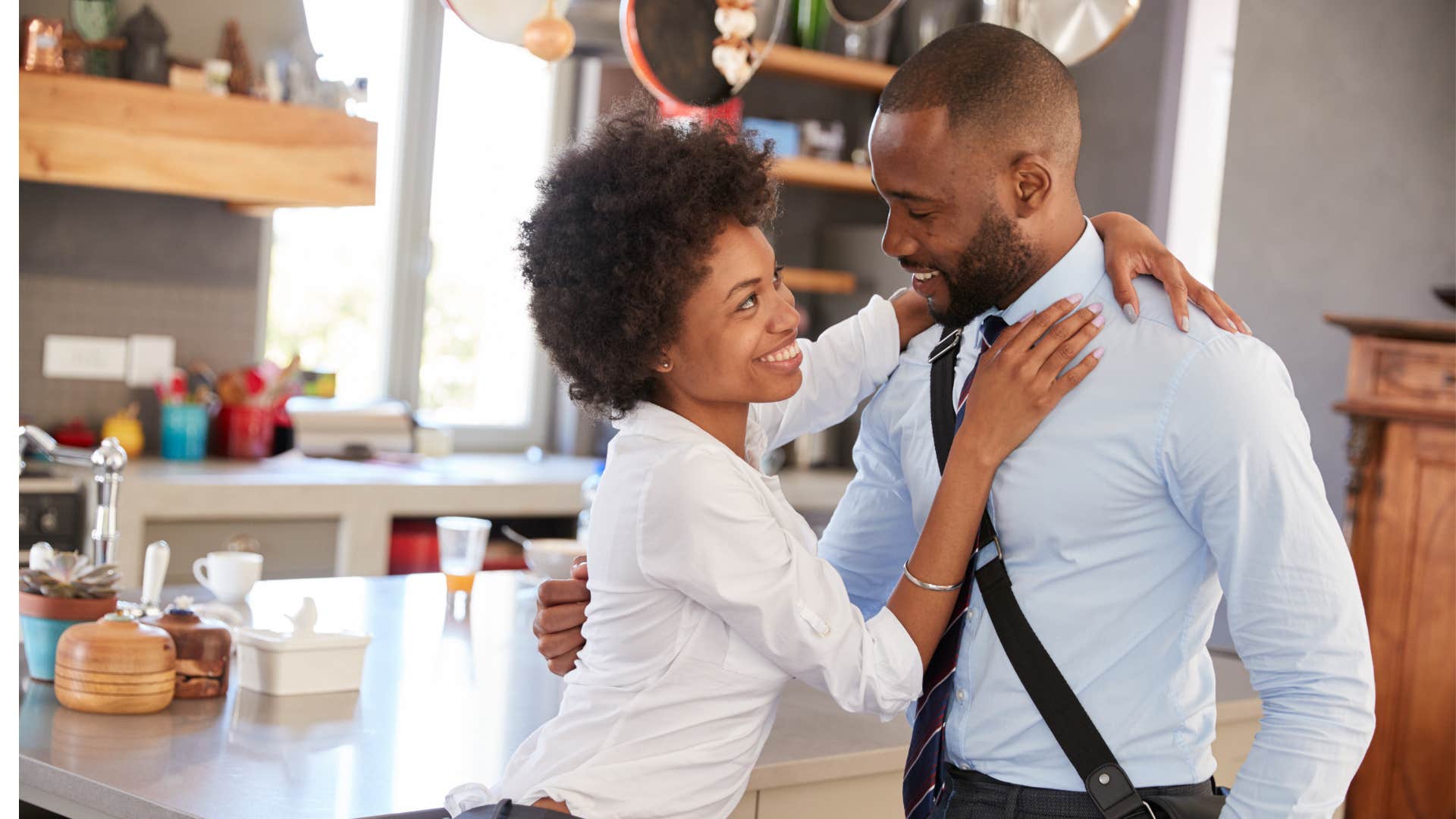 Affectionate couple embrace showing resolved fight