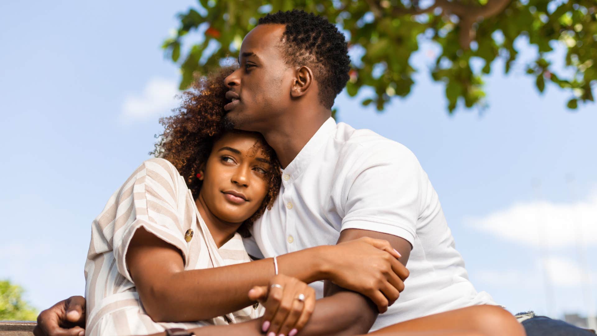 woman hugging husband saying lets do this together