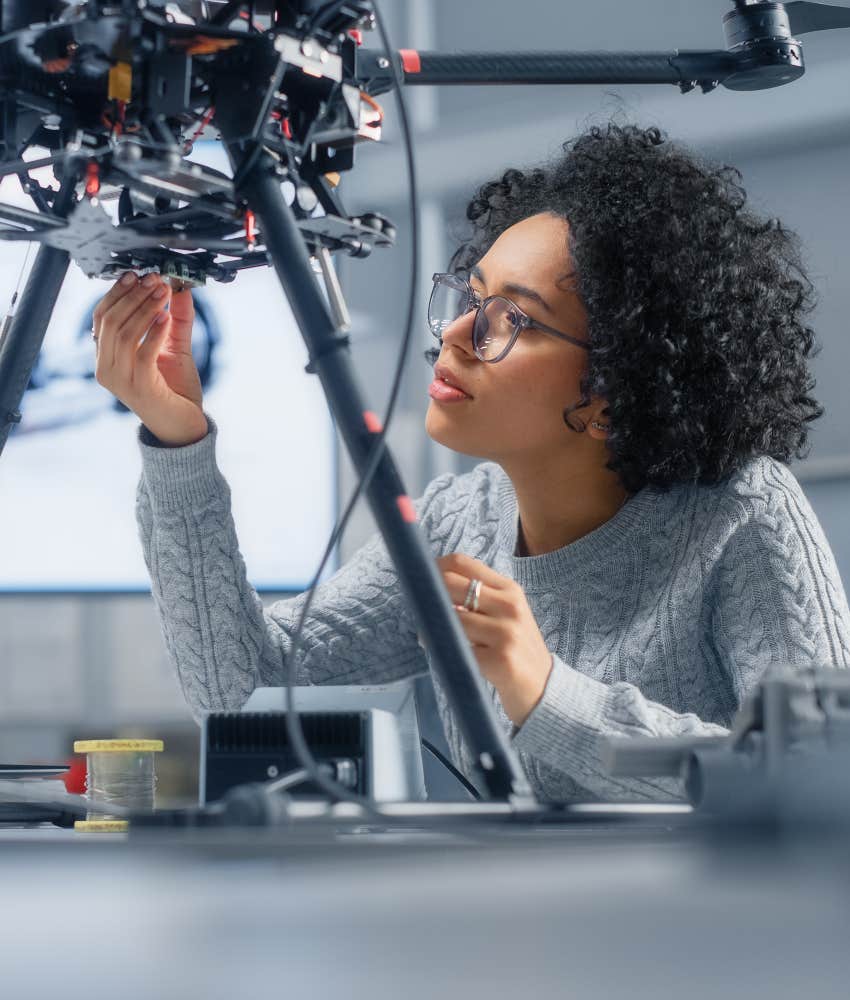 innovative woman working on machine