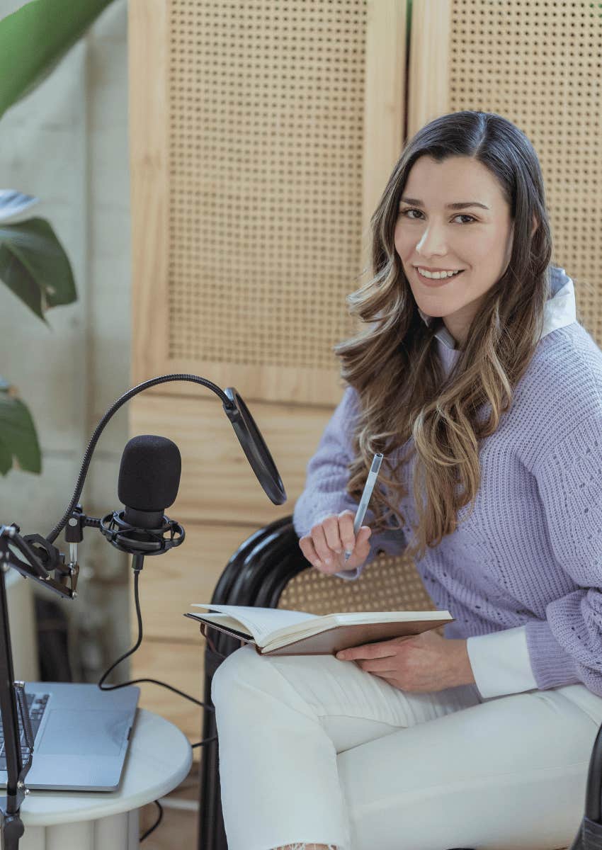 inspired young woman taking notes