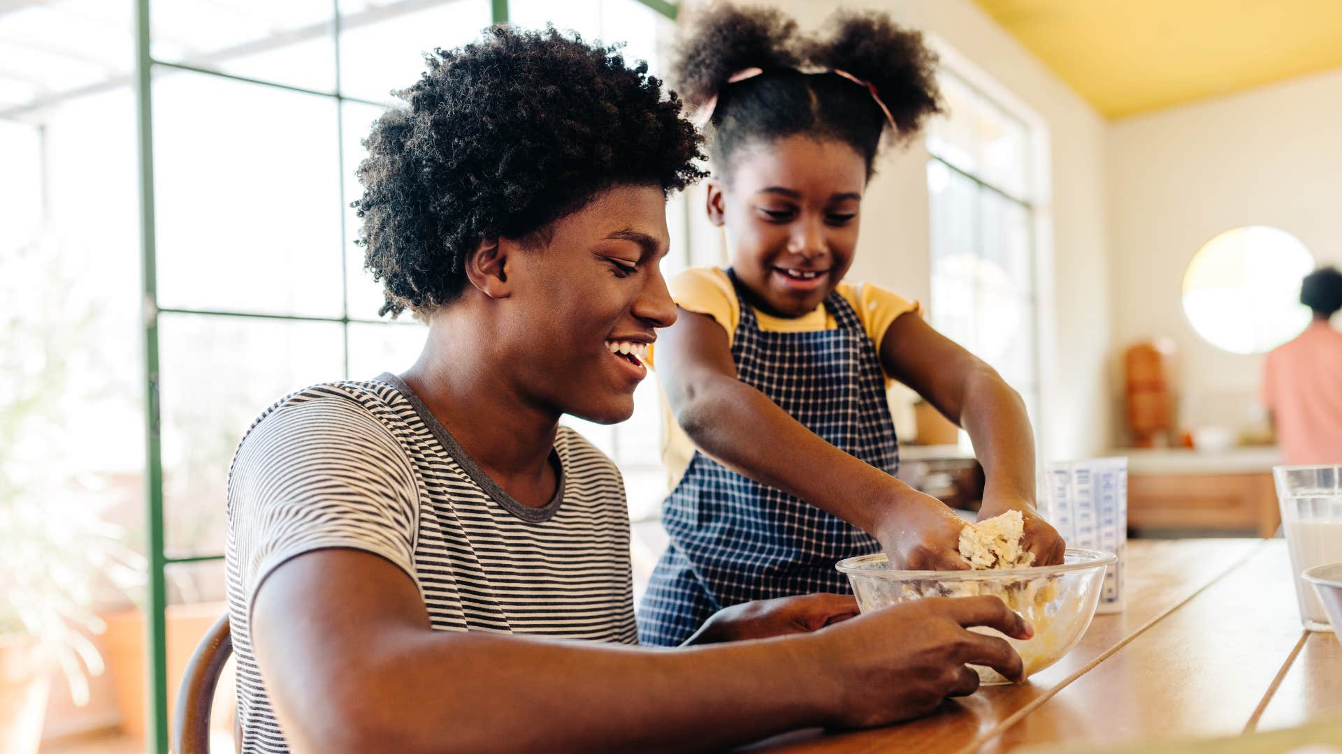 Happy siblings baking together showing way kids feel seen