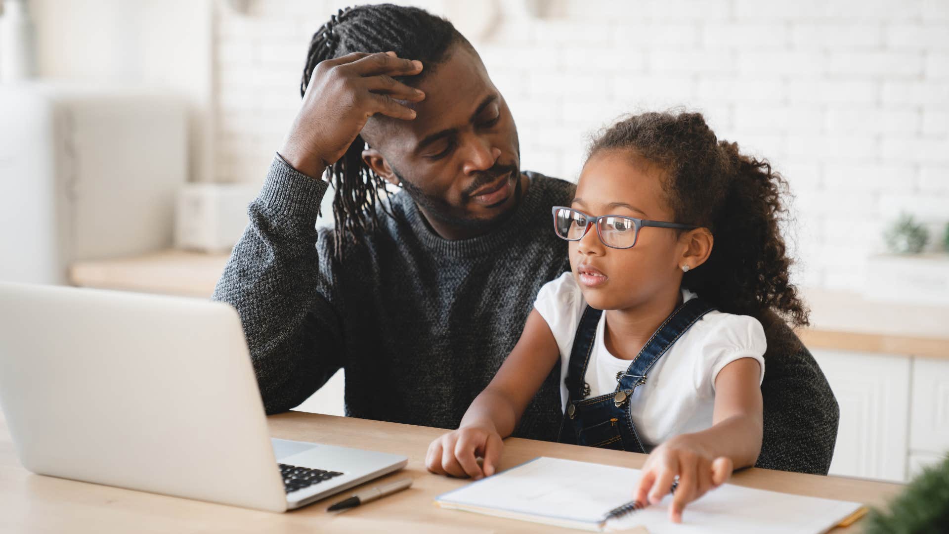 Attentive parent helps child with homework showing way kids feel seen