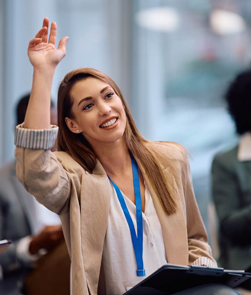 Confident person asks question in group showing way to manage hard life